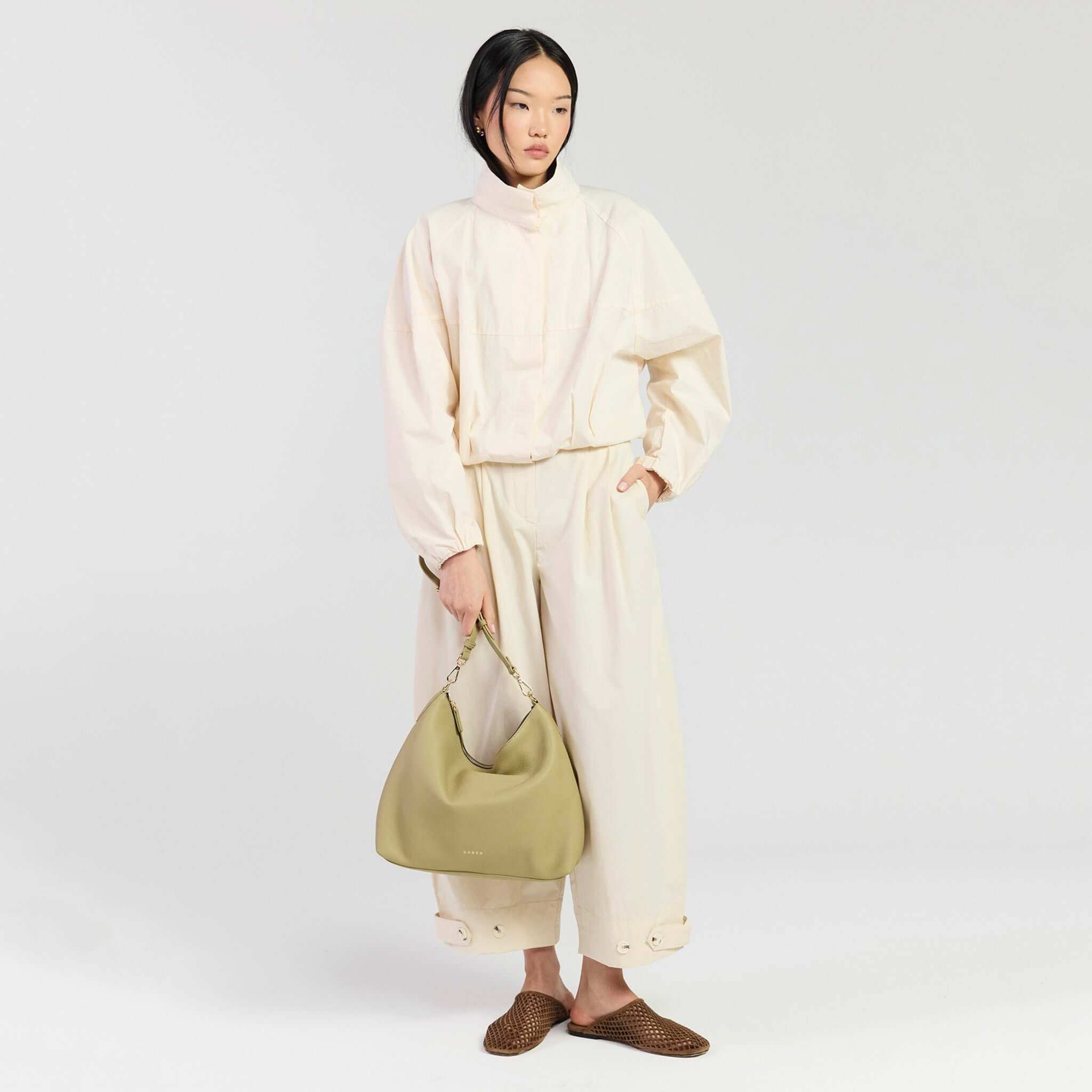Model wearing the Saben Miki Shoulder Bag - Willow Luxe in an elegant outfit for a polished look.