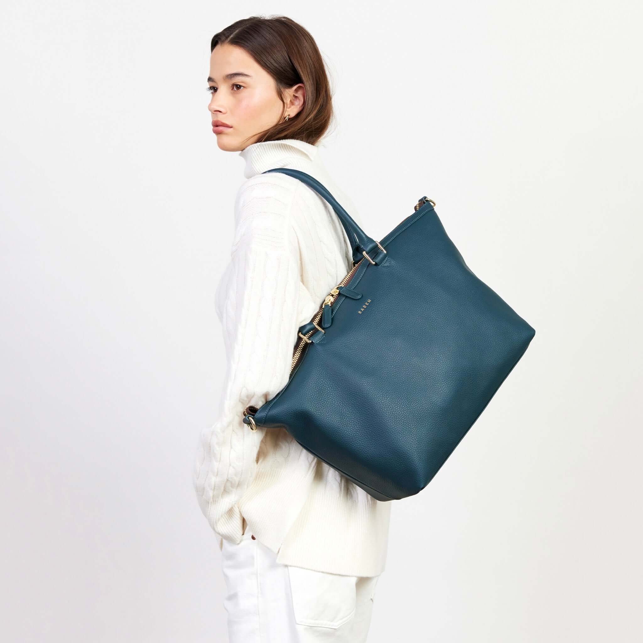 Alt Tag: Saben Milan Carry-All Bag - Hunter Green worn on shoulder, spacious carry-all tote with adjustable strap for work, gym or baby essentials