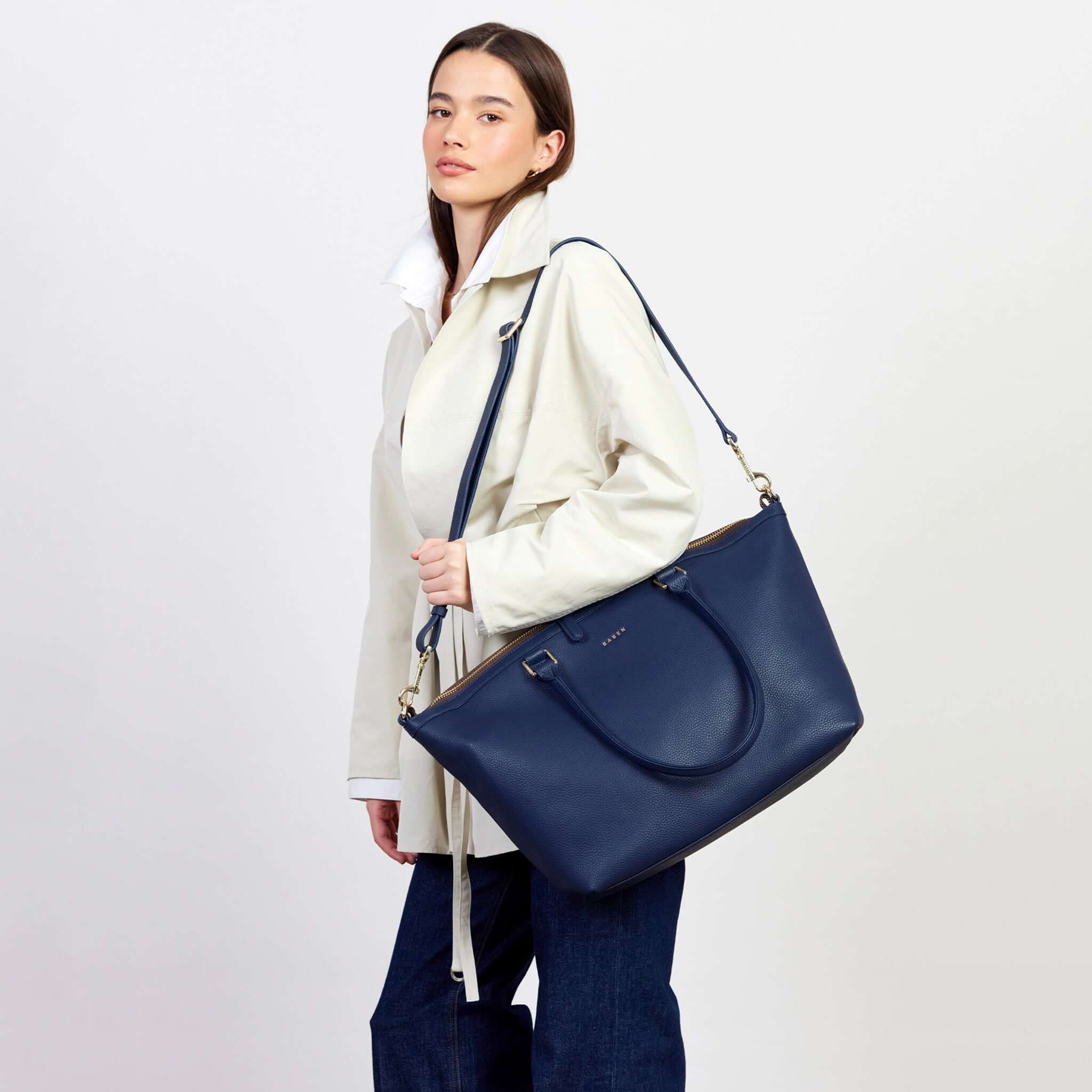 Model showcasing the Saben Milan Carry-All Bag - Ink, a stylish and spacious bag for everyday use.