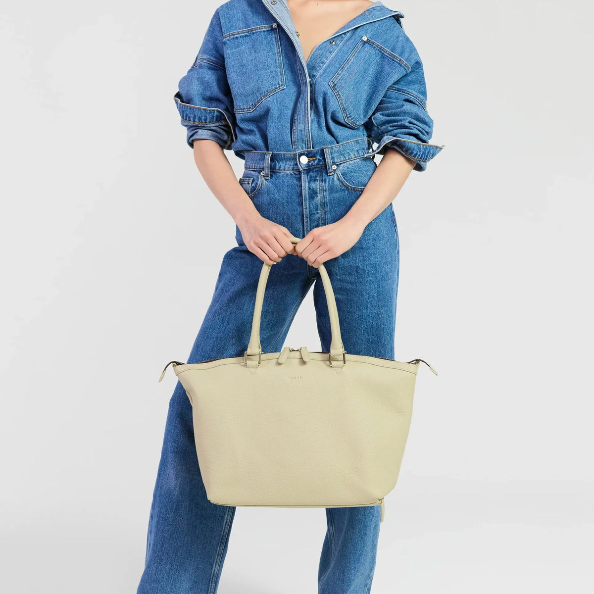 Saben Milan Carry-All Bag - Oyster held by the top handles, close-up
