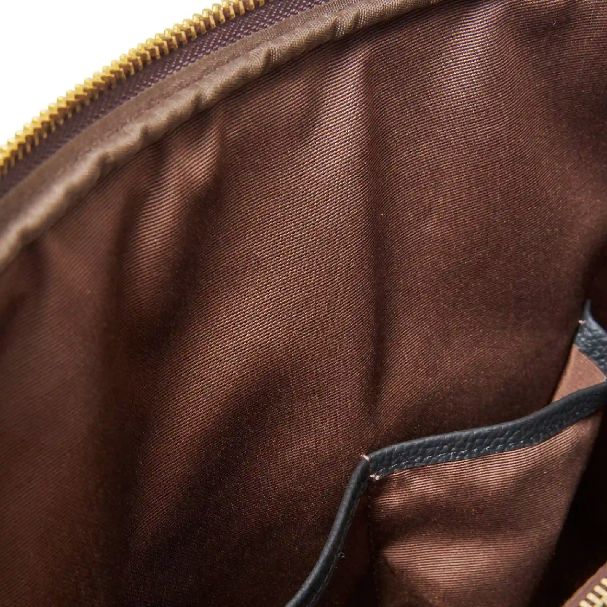 Close-up of a brown fabric surface with a zipper