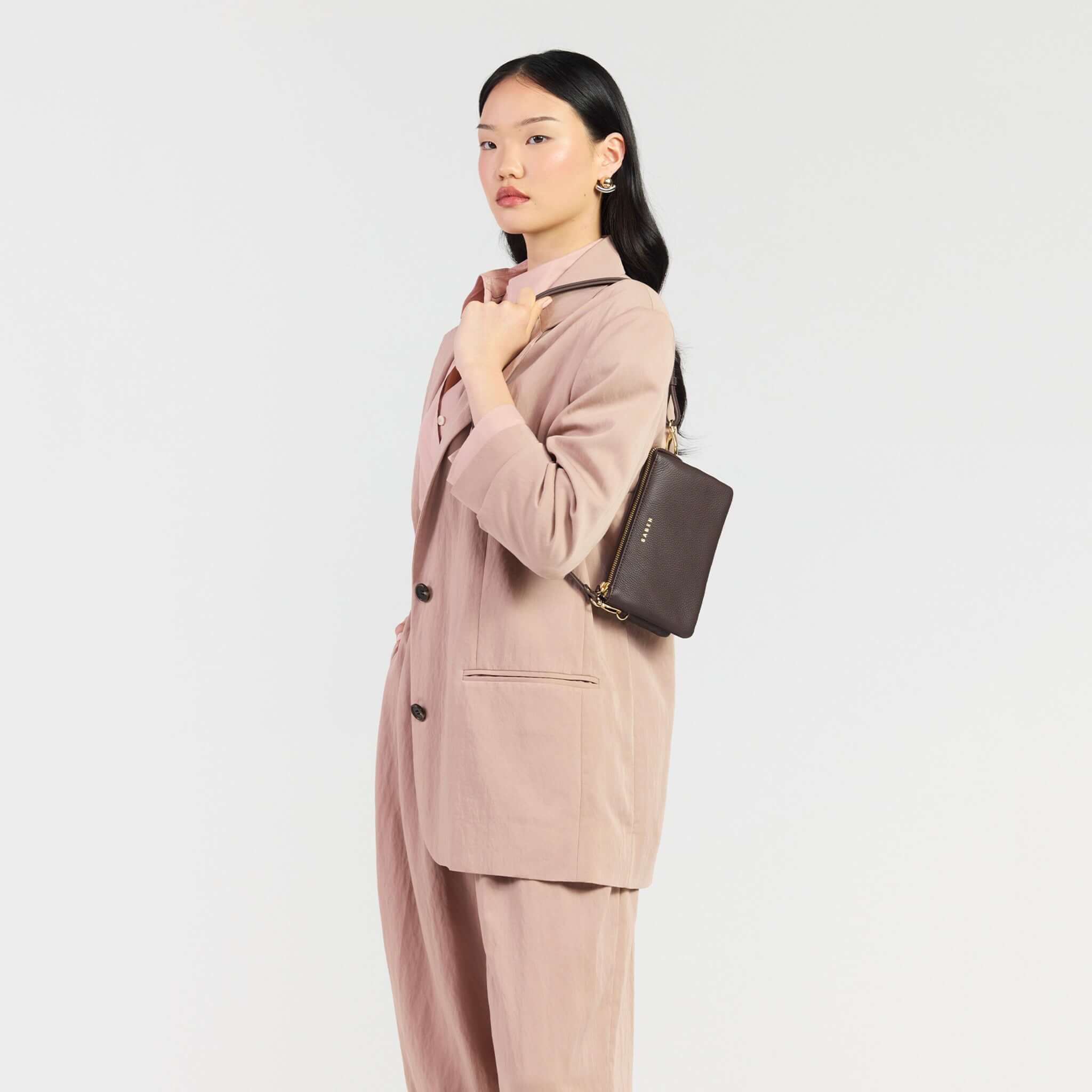 Saben Tilly Crossbody Bag - Cacao worn by model in a stylish outfit, showcasing its versatility and elegance.