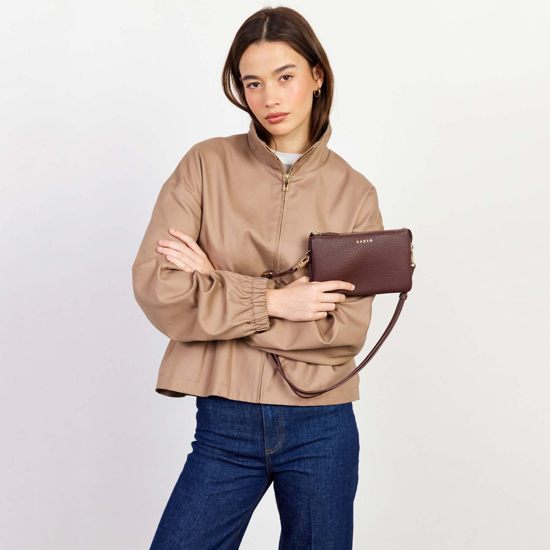 Saben Tilly Crossbody Bag - Espresso worn as leather crossbody clutch on model with detachable strap
