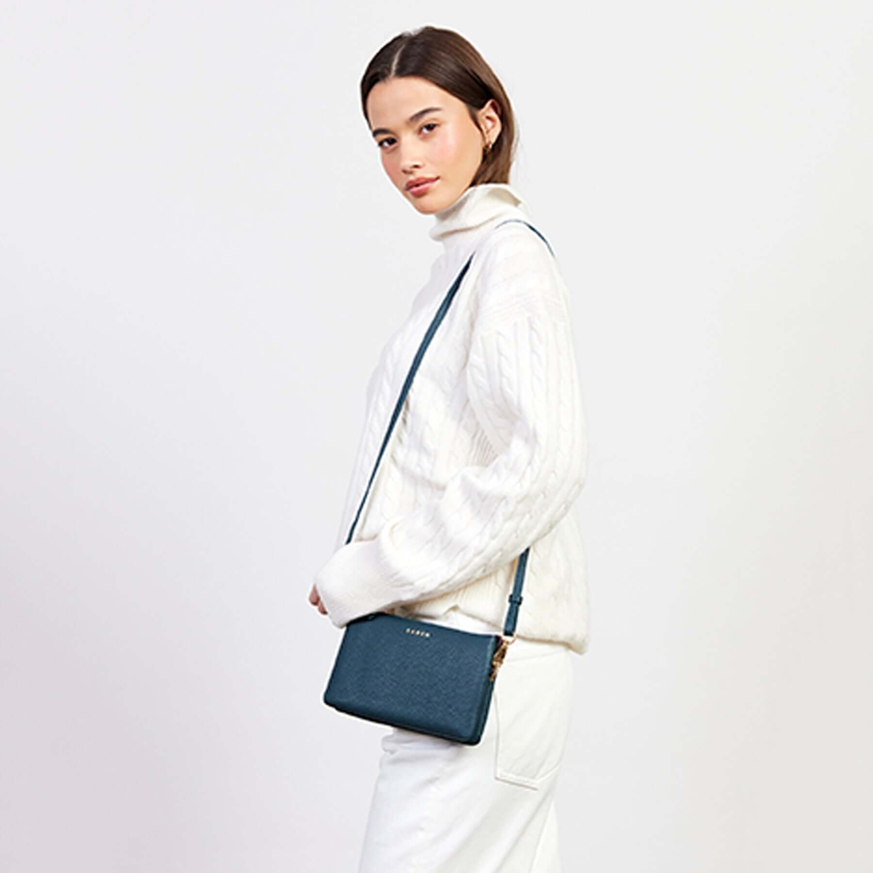 Alt Tag: Model wearing Saben Tilly Crossbody Bag - Hunter Green leather wallet clutch crossbody with adjustable strap