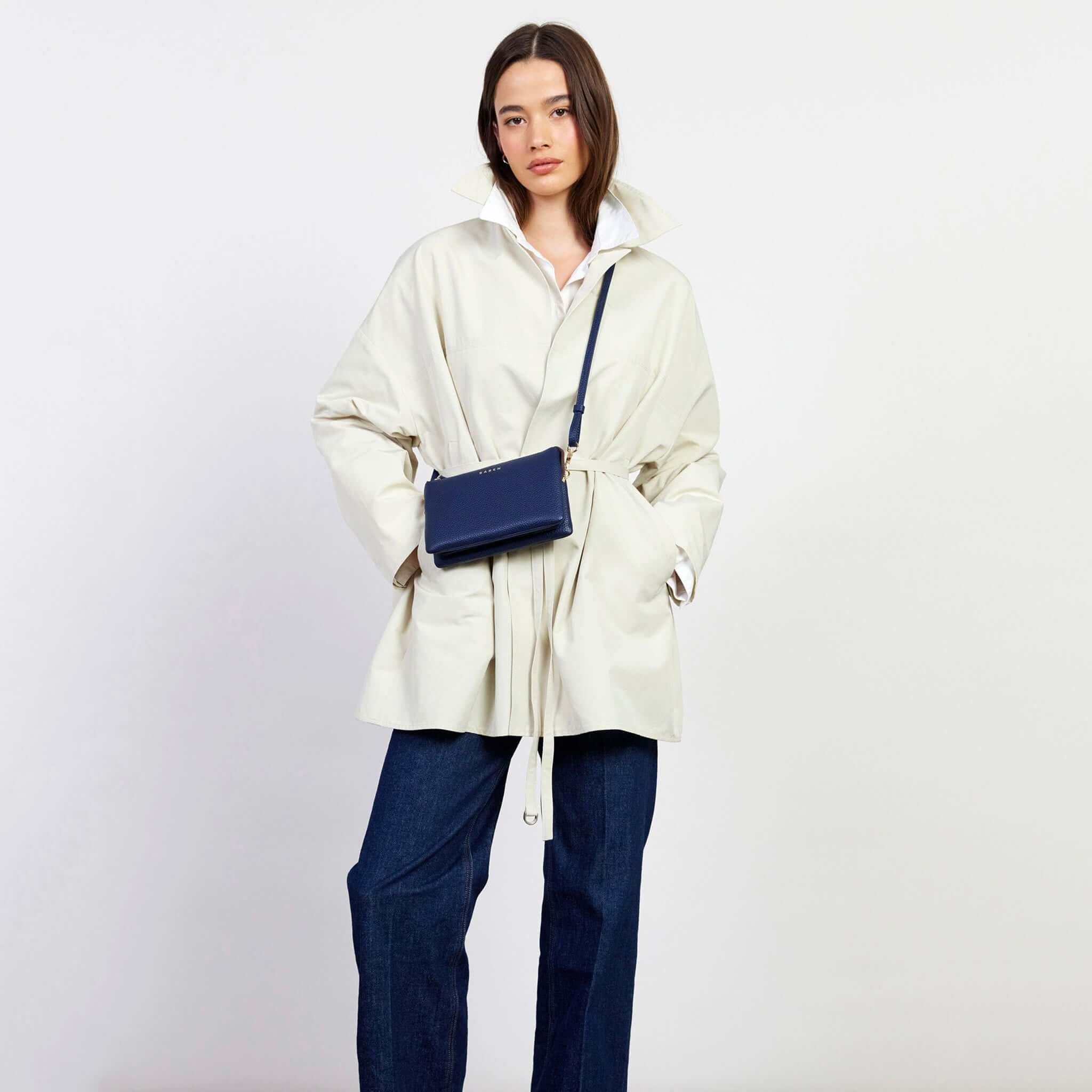 Saben Tilly Crossbody Bag - Ink worn by a model in a stylish outfit, showcasing its versatility as an accessory.
