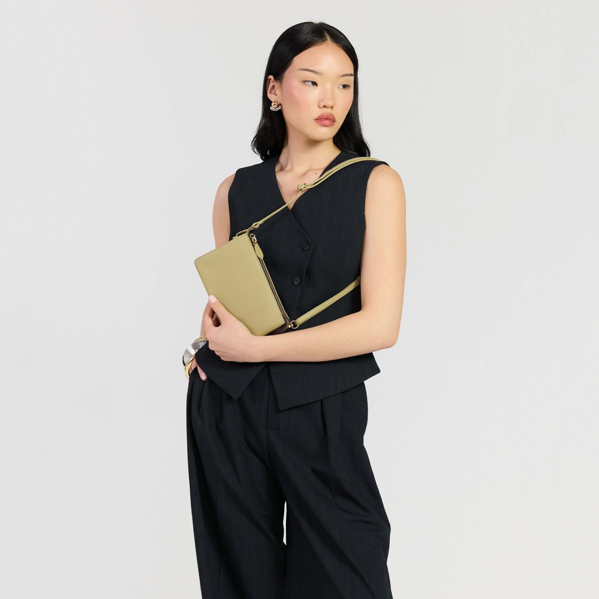 Saben Tilly Crossbody Bag - Willow being modeled, showcasing its stylish design and versatility.