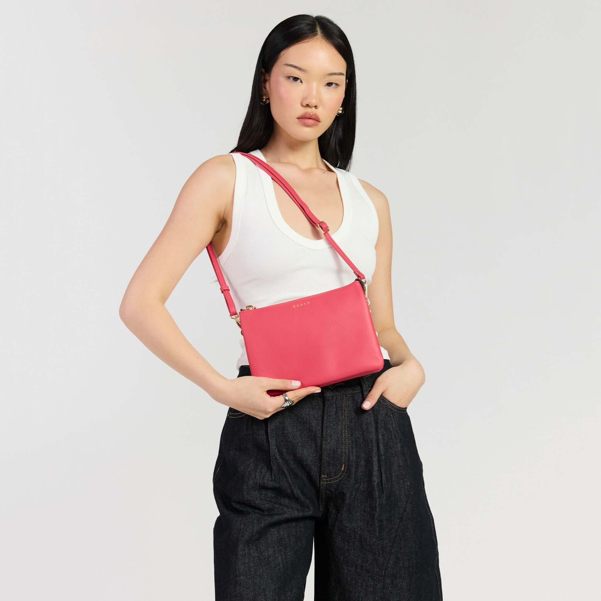 Saben Tilly's Big Sis Crossbody Bag - Azalea worn by a model with stylish outfit on a neutral background.