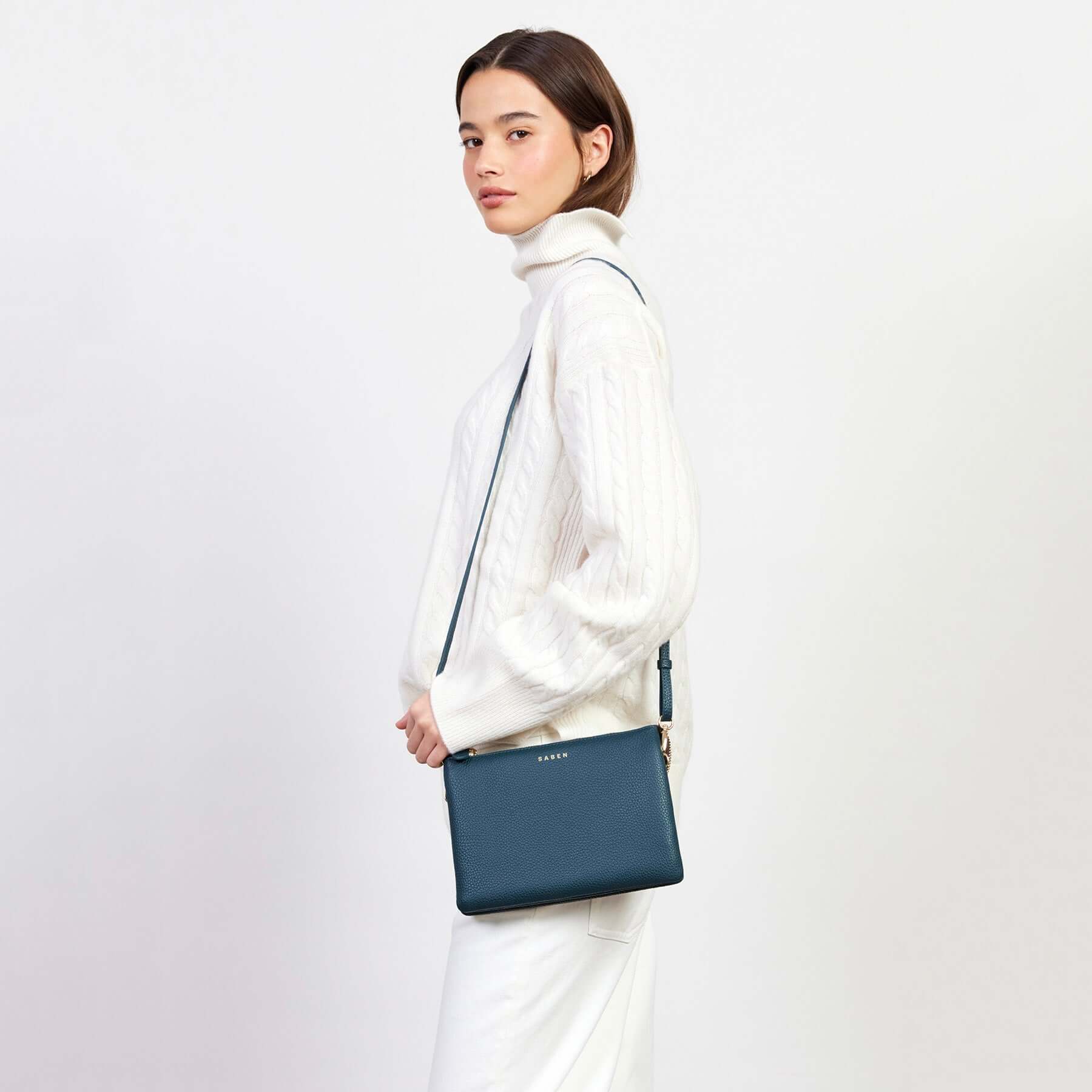 Alt Tag: Model wearing Saben Tilly's Big Sis Crossbody Bag - Hunter Green pebbled leather crossbody with adjustable strap