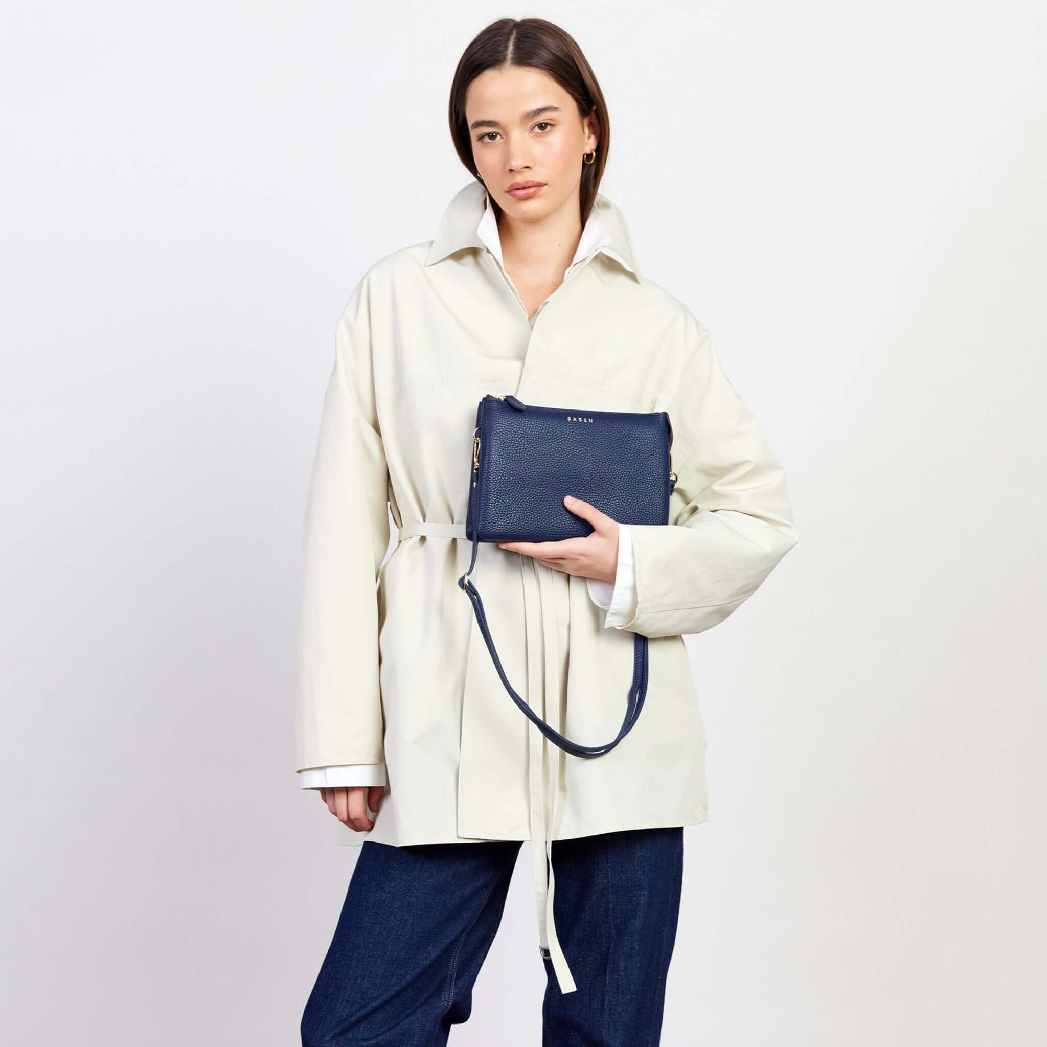 Saben Tilly's Big Sis Crossbody Bag - Ink in stylish model's hands with chic outfit background.