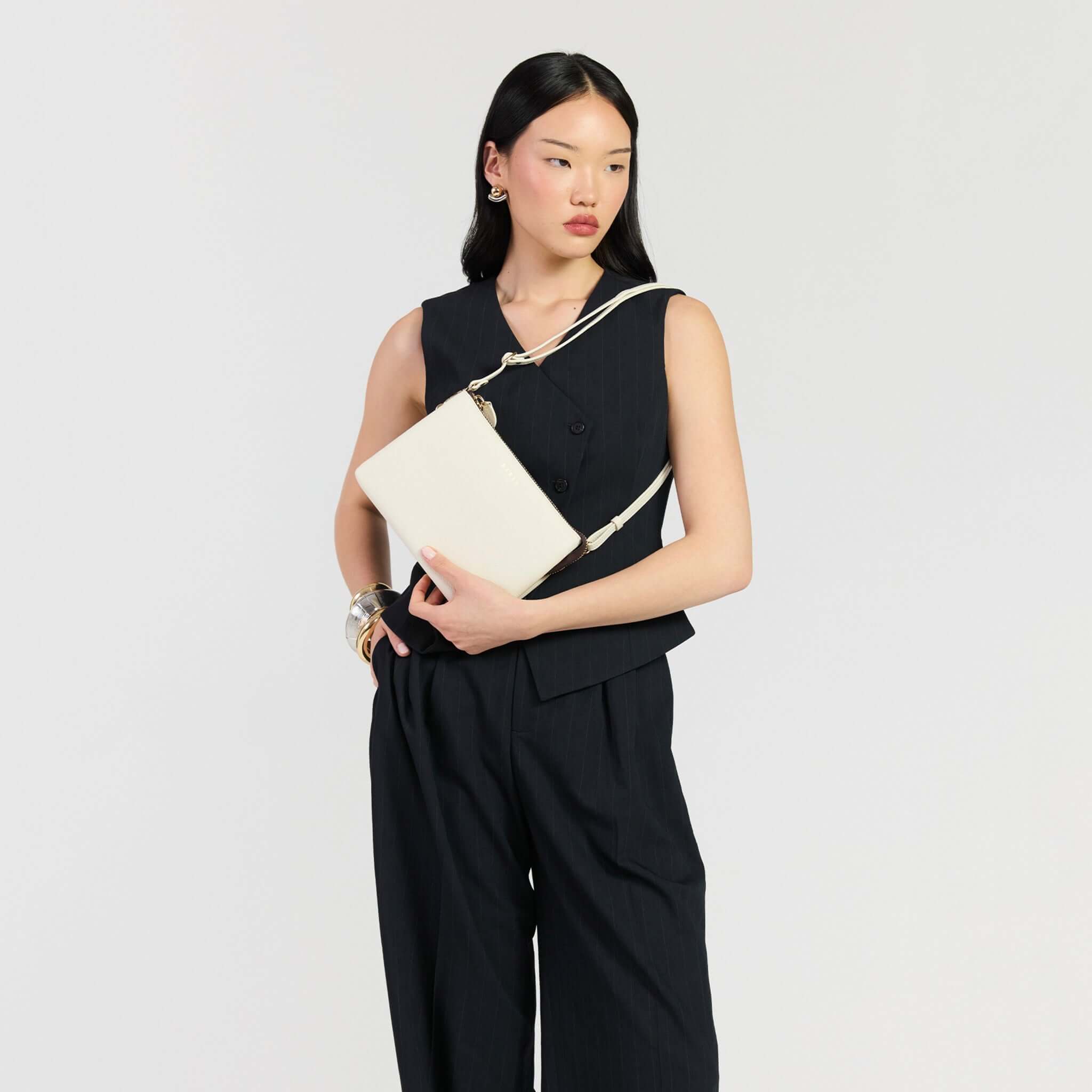Model showcasing Saben Tilly's Big Sis Crossbody Bag - Quartz in a stylish outfit.