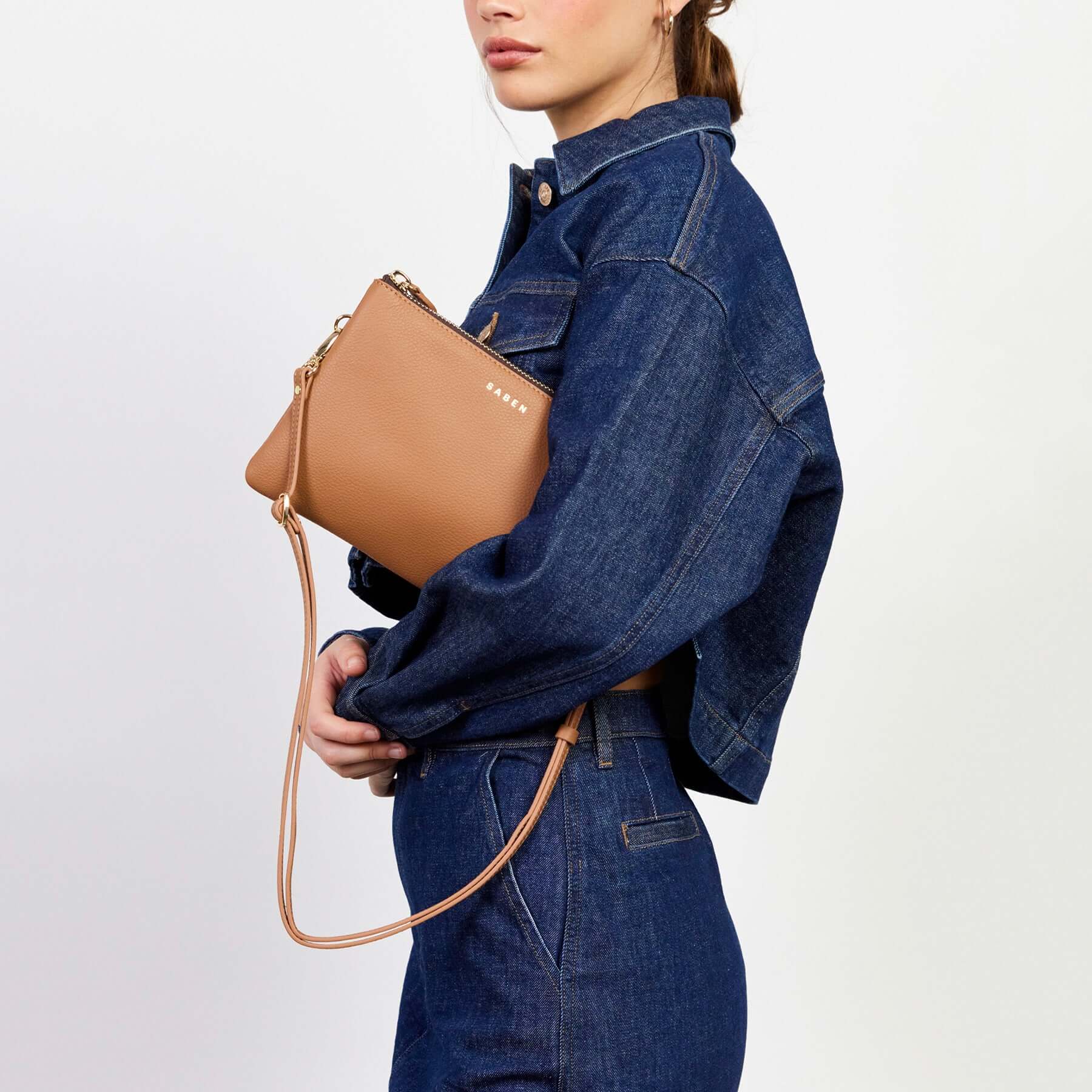 Alt Tag: Saben Tilly's Big Sis Crossbody Bag - Toffee pebbled leather crossbody with strap, worn on model in denim