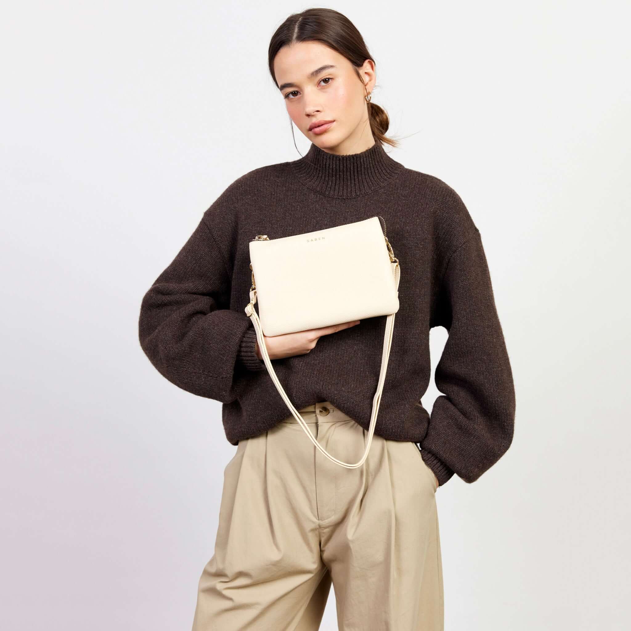 Alt Tag: Saben Tilly's Big Sis Crossbody Bag - Vanilla in pebbled vanilla leather worn crossbody, roomy multi-compartment organiser
