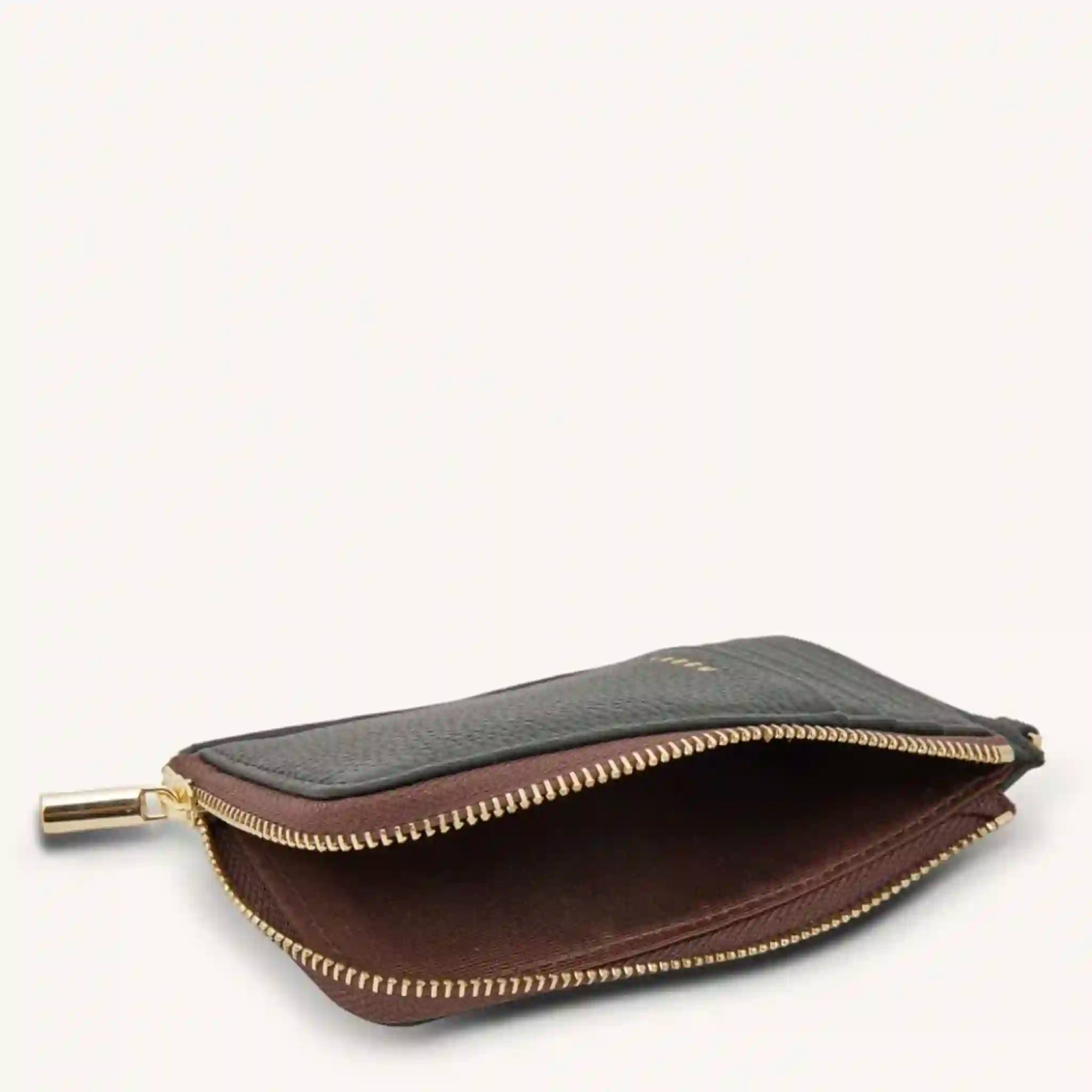 Two-tone wallet with gold zipper on a white background