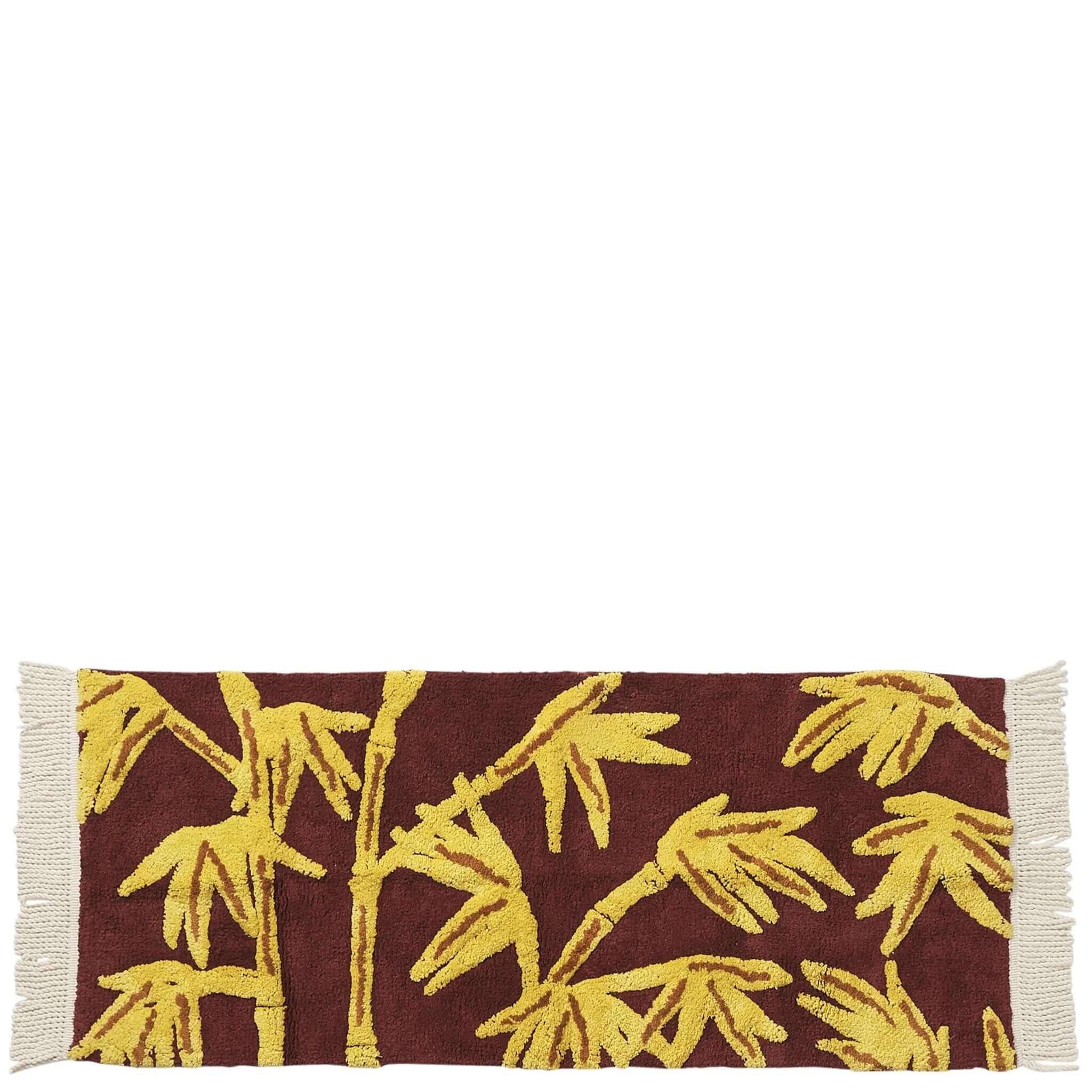 Sage x Clare Aneta Bath Runner featuring a hand-tufted bamboo design in golden yellow on deep burgundy.