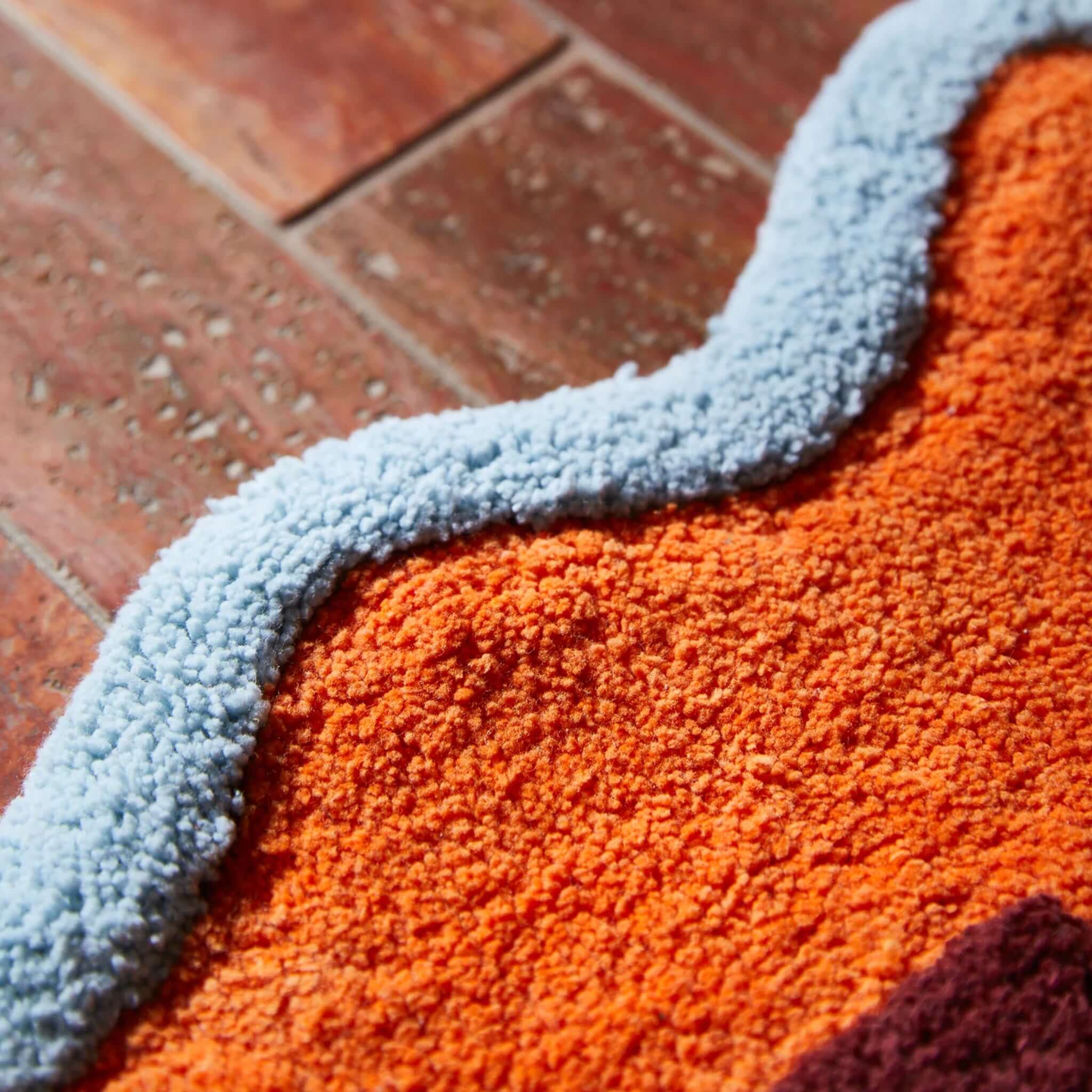 Sage x Clare Amalie Nudie Bath Mat - Orangerie corner detail showcasing plush texture and vibrant colors.