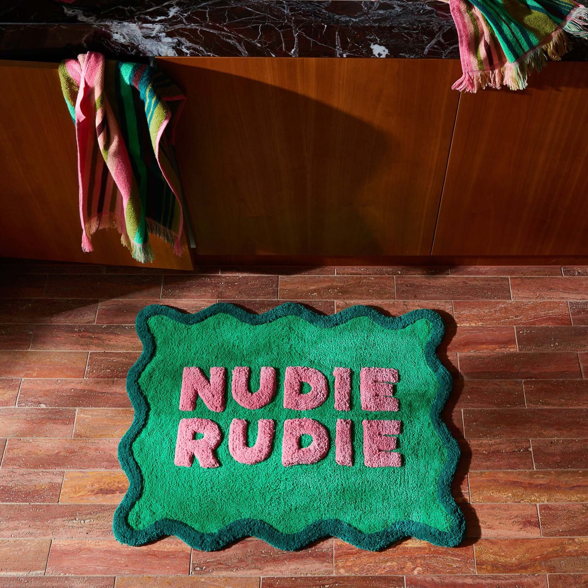 Sage x Clare Amalie Nudie Bath Mat - Spring Green with playful nudie rudie design on a plush, absorbent surface.