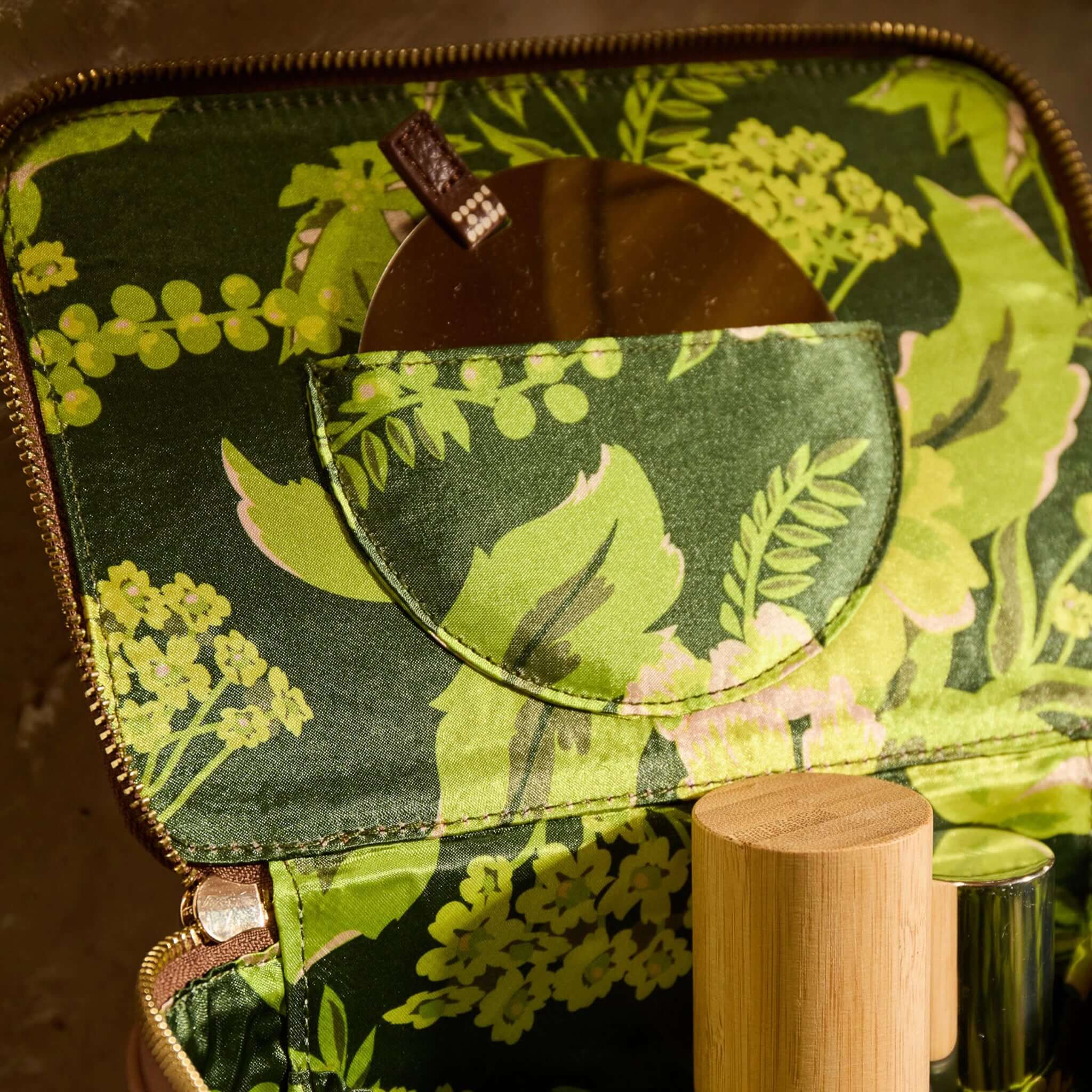 Sage x Clare Bonny Medium Vanity Case - Umber interior featuring a floral design and storage for beauty essentials.