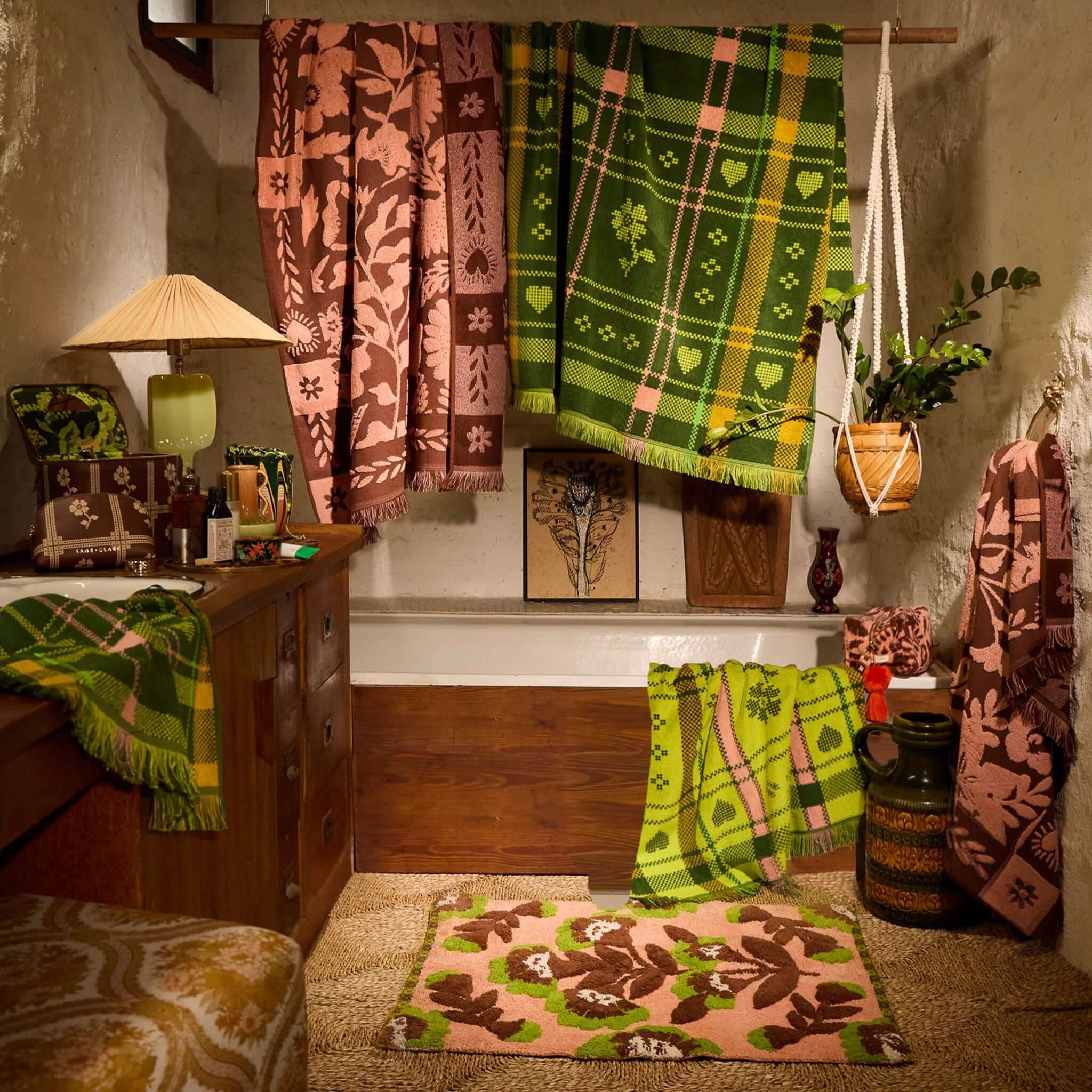 Sage x Clare Bonny Medium Vanity Case - Umber displayed among colorful decor and textiles in a cozy setting.