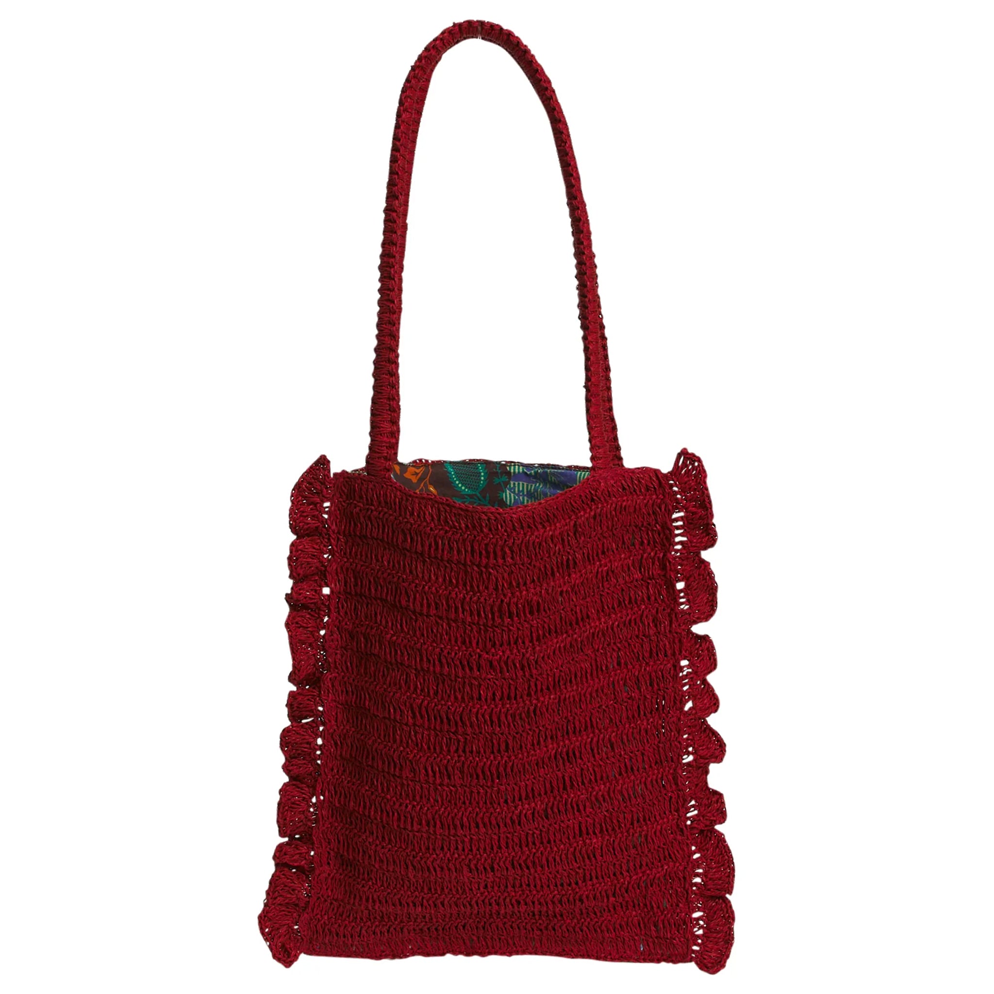 Red woven handbag with a textured pattern on a white background