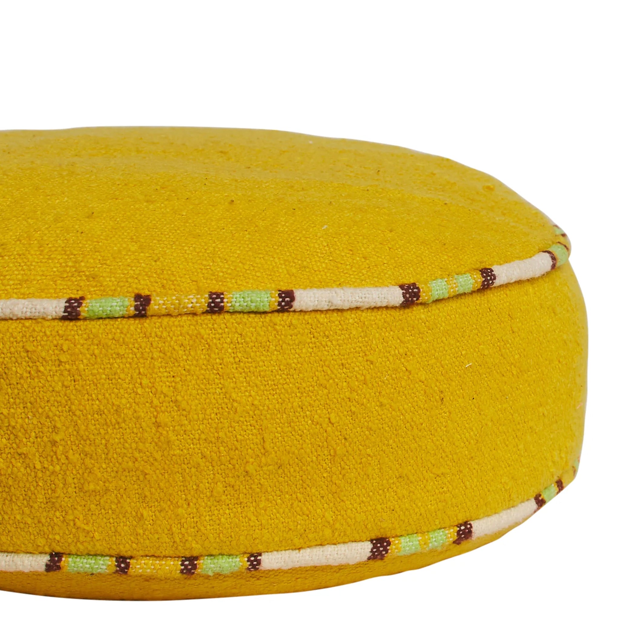 Yellow fabric cushion with decorative stitching on a white background