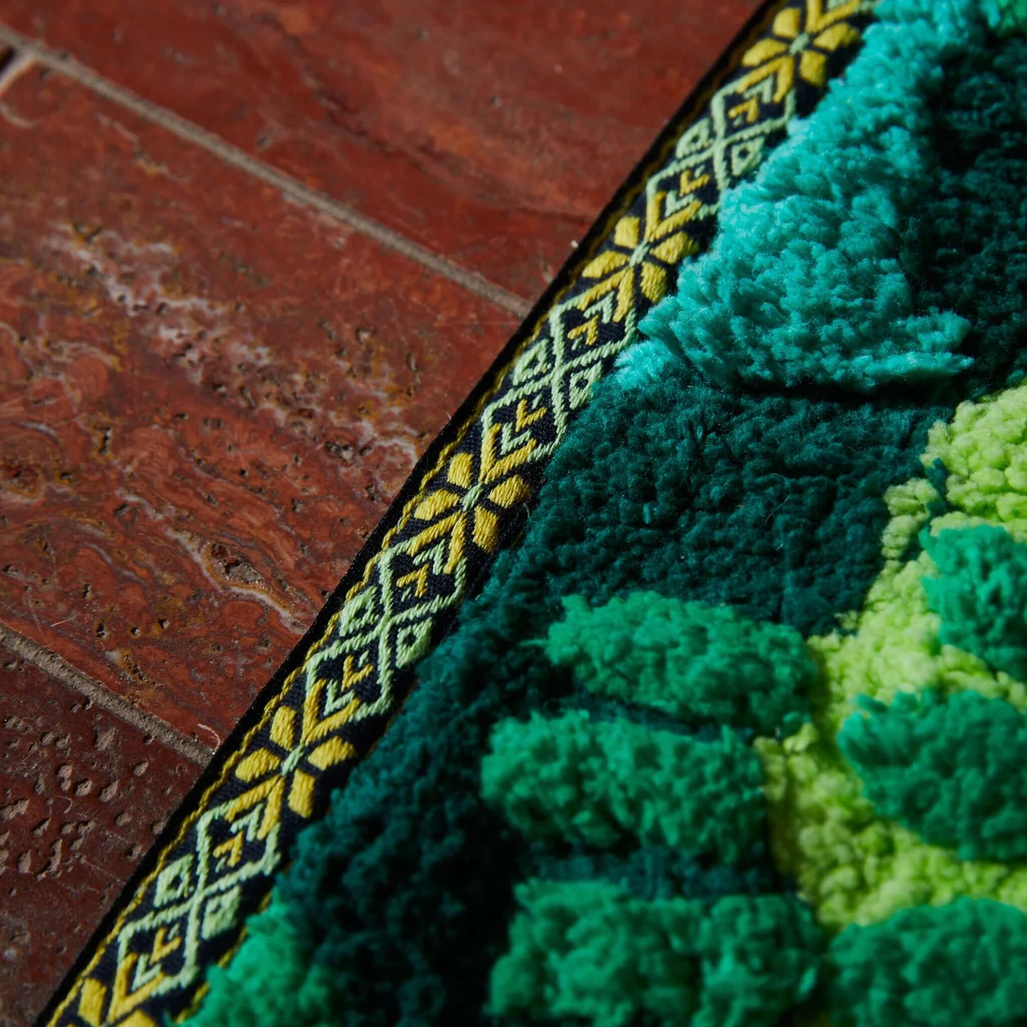 Sage x Clare Eliza Bath Mat - Spring Green close-up of plush GOTS organic cotton floral bath mat with patterned border