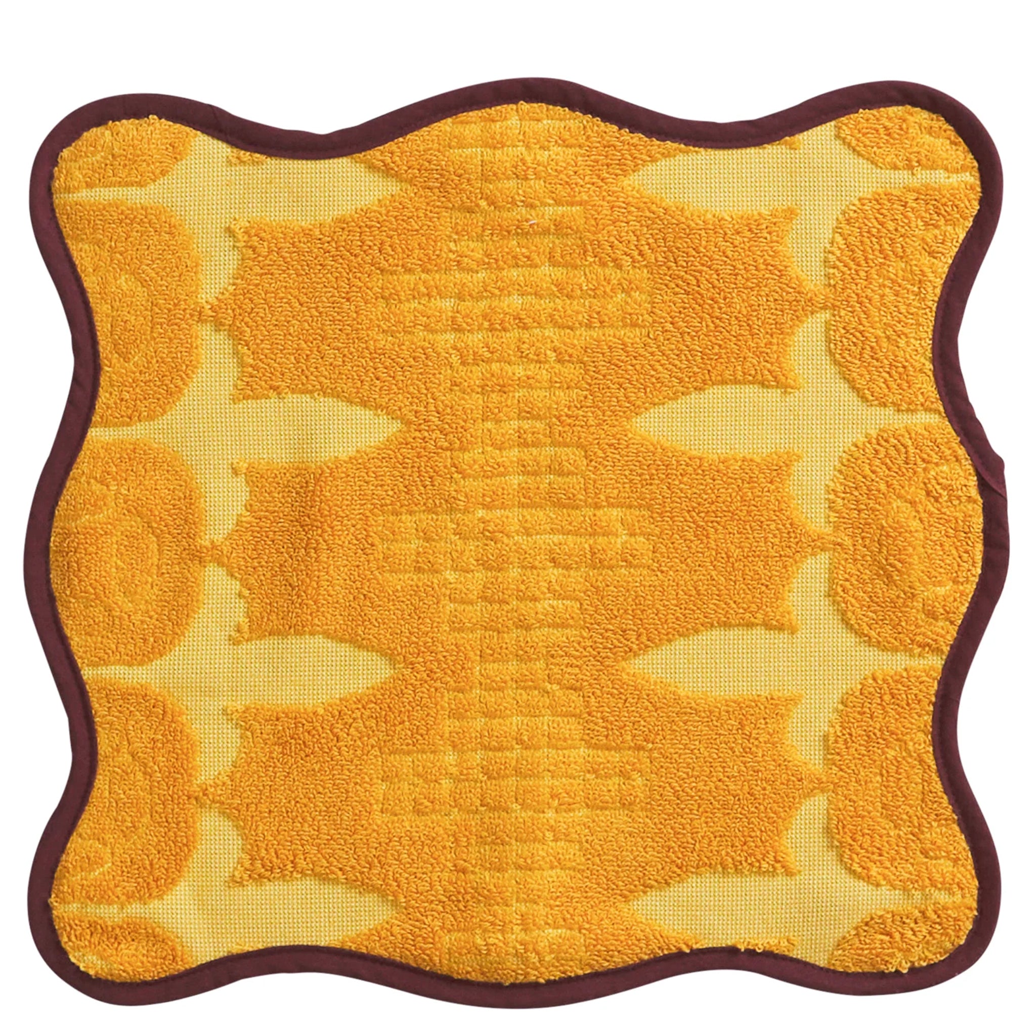 Yellow textured face cloth with brown border on a white background