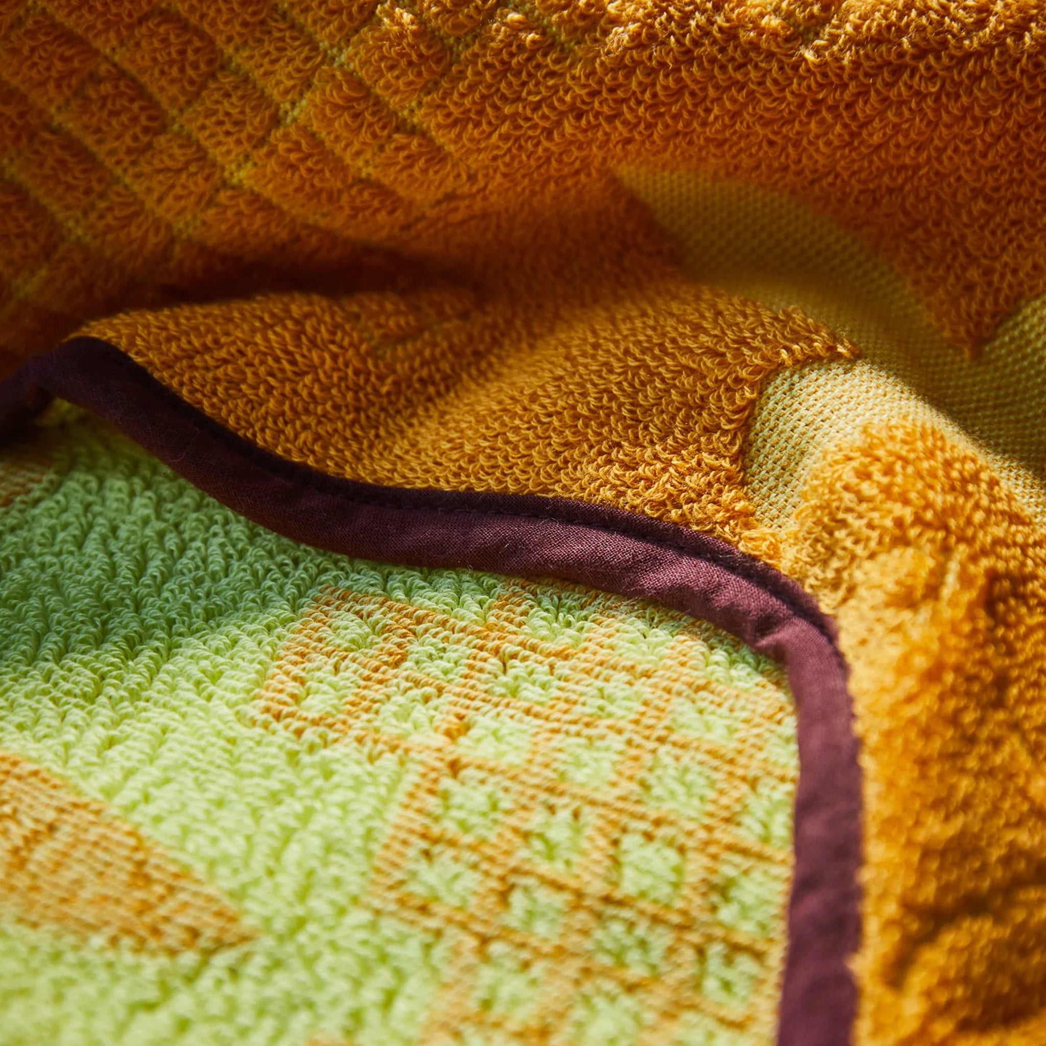 Close-up of textured fabric with green and brown colors