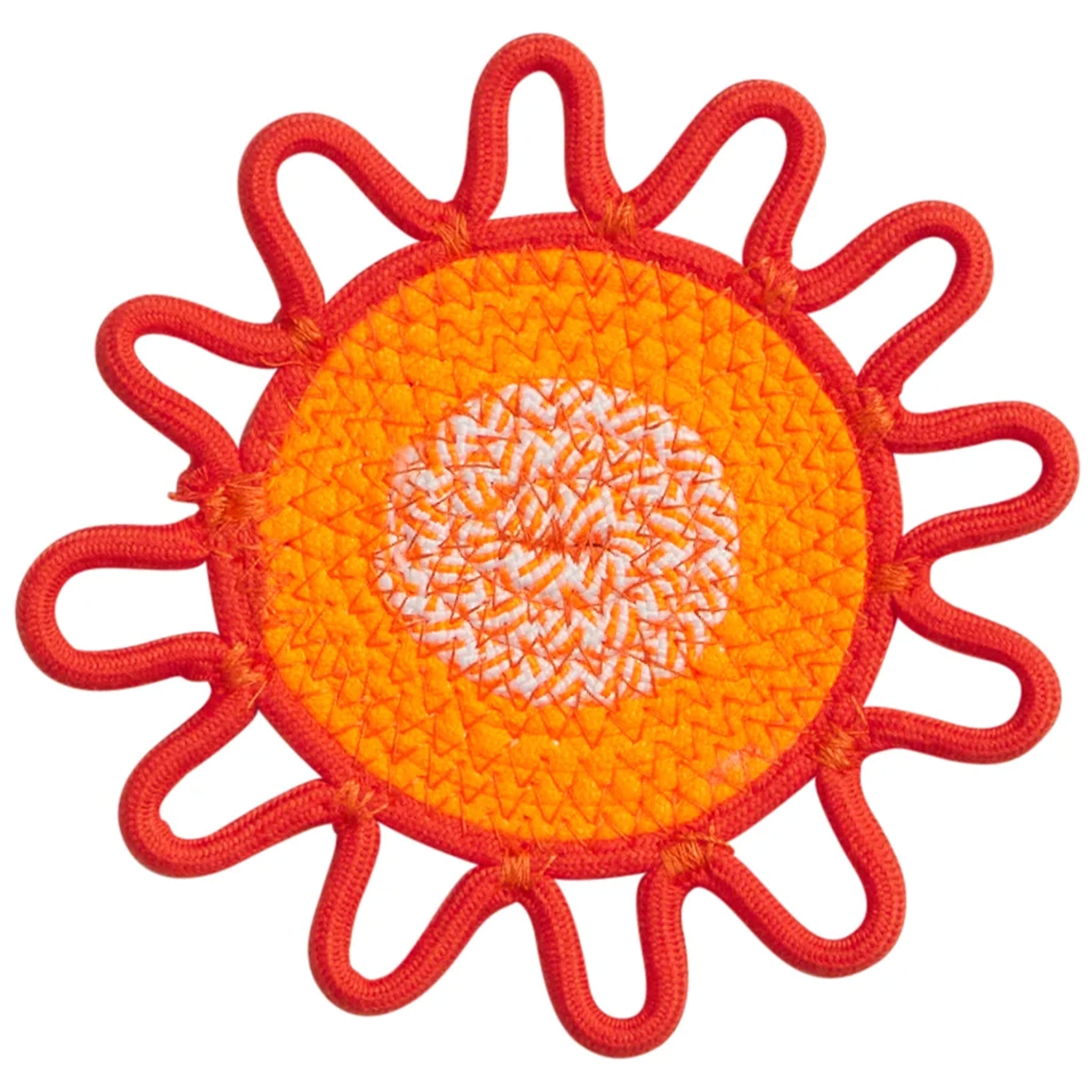 Sun-shaped coaster with red border and orange center on a white background