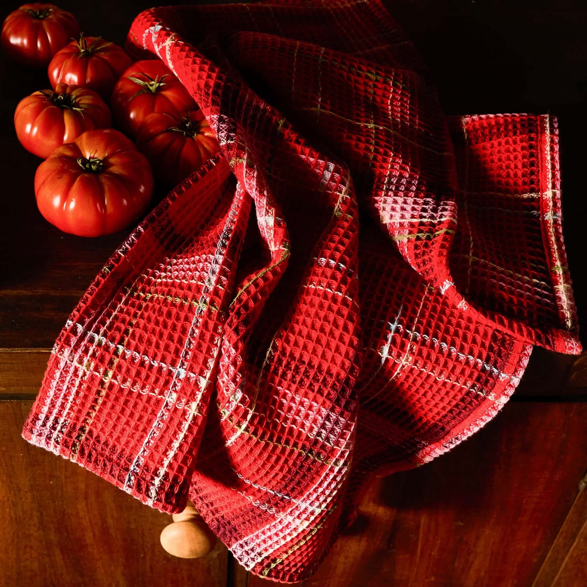 Sage x Clare Frances Organic Cotton Waffle Tea Towel - Poppy with red plaid pattern next to fresh tomatoes.