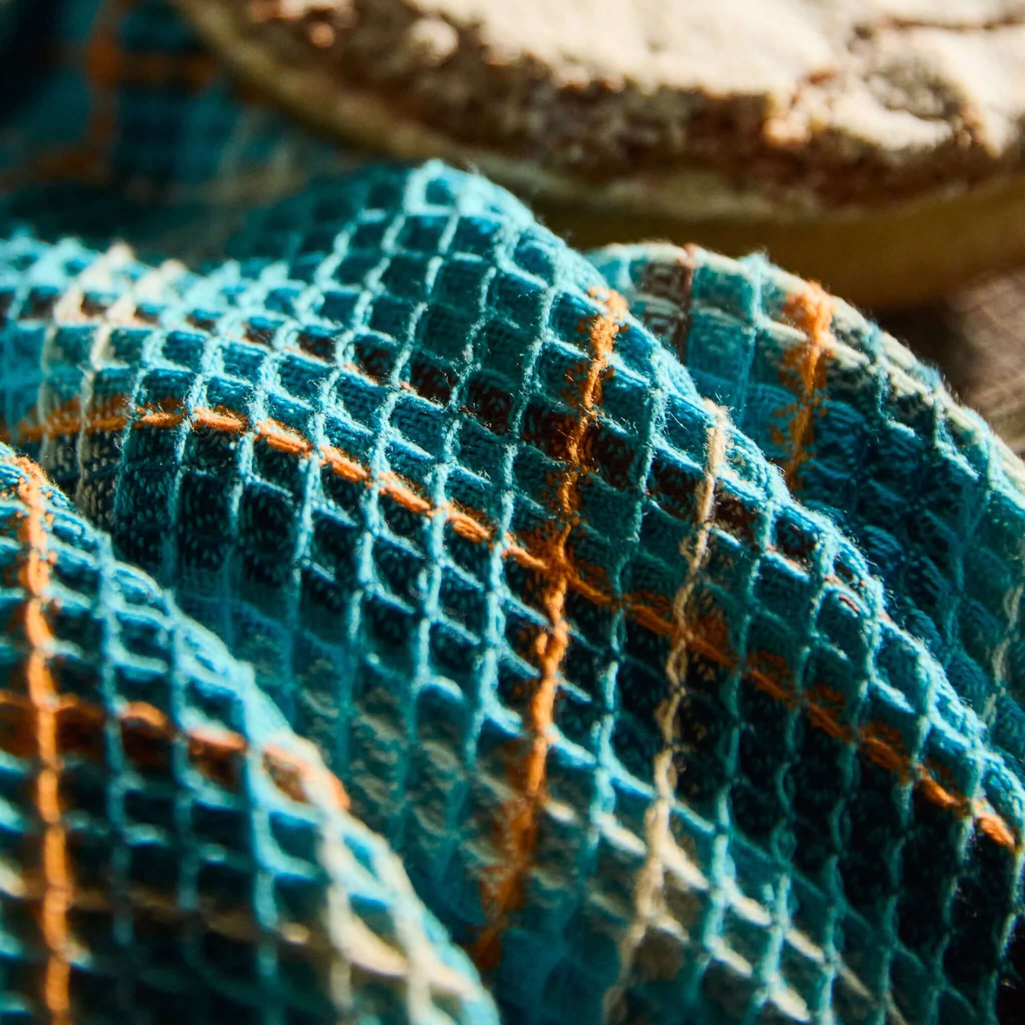 Sage x Clare Frances Organic Cotton Waffle Tea Towel - Turquoise in a textured waffle weave with a bright turquoise plaid.