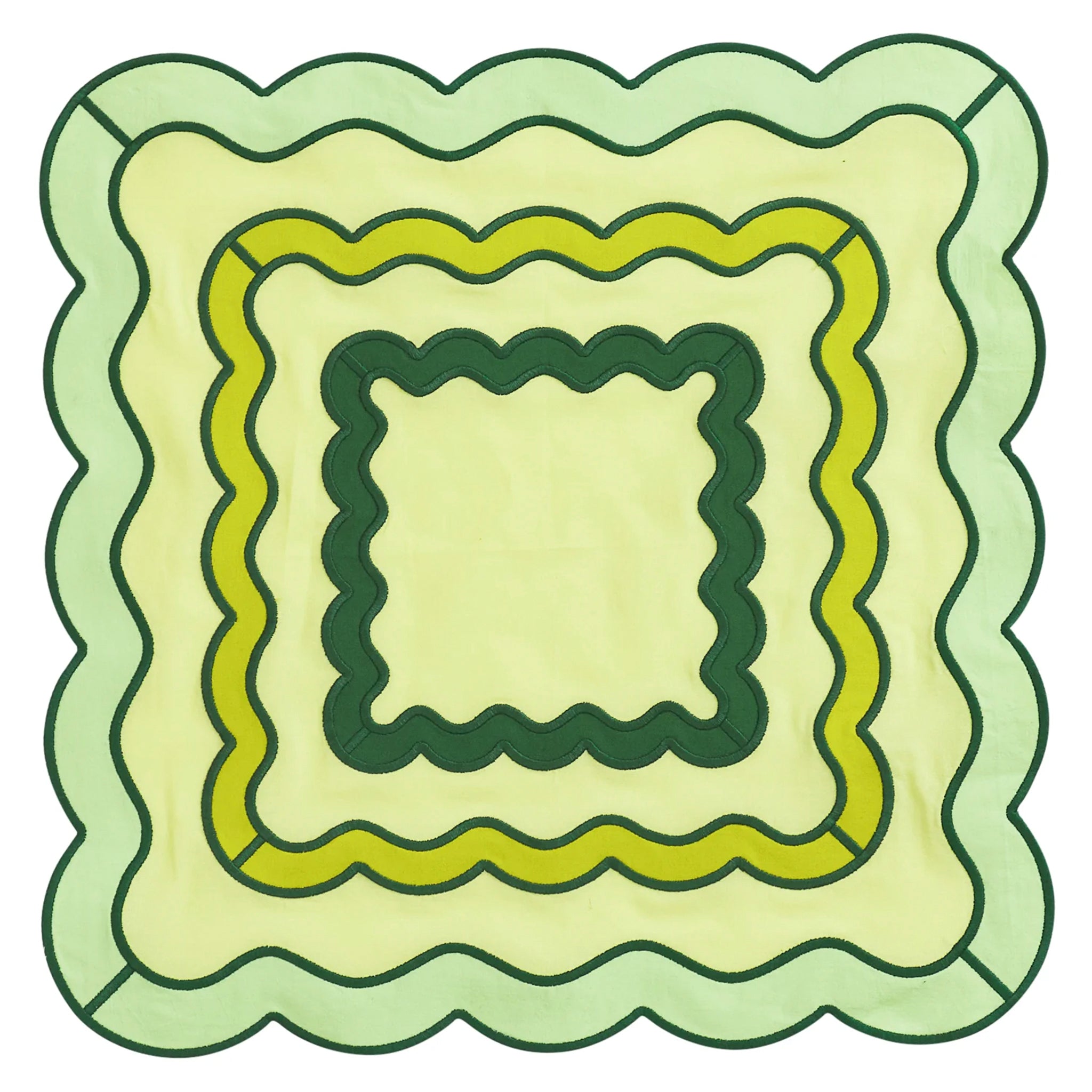 Decorative quilt napkin with green and beige colours on a white background