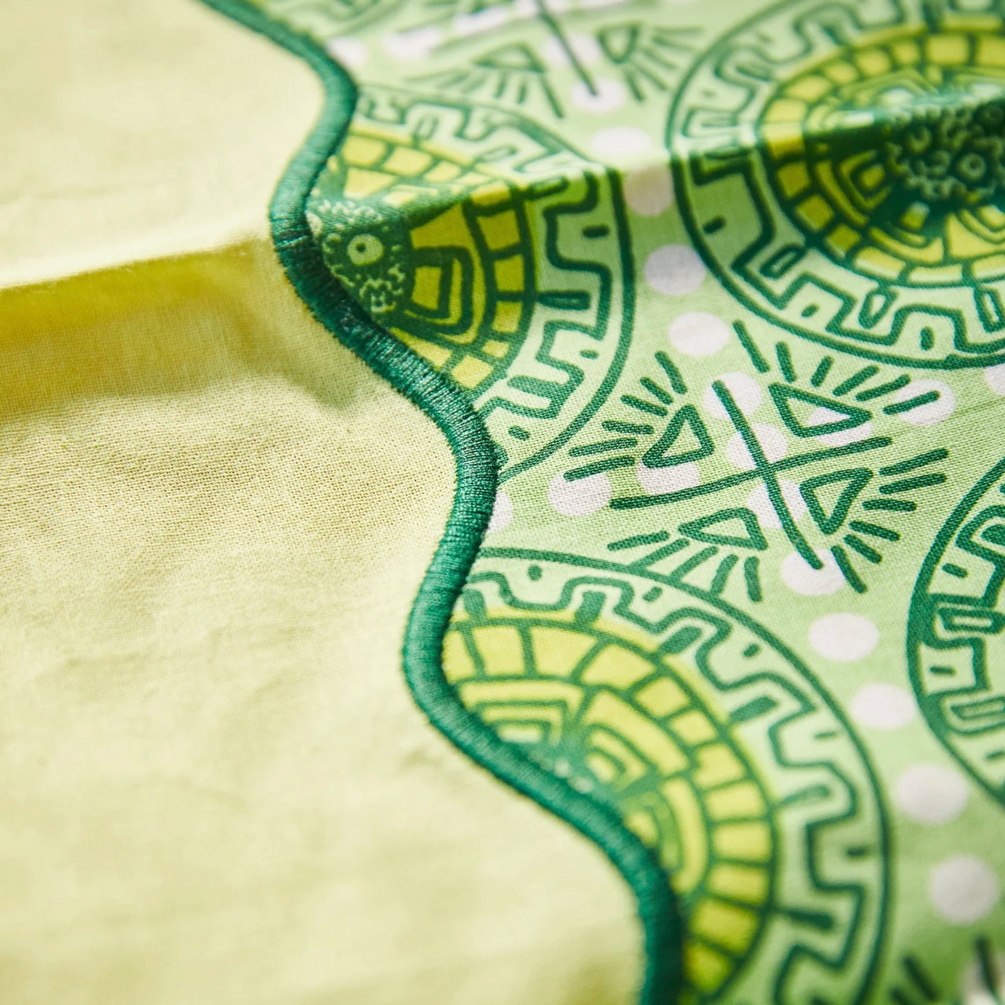 Close-up of green and yellow patterned napkin.