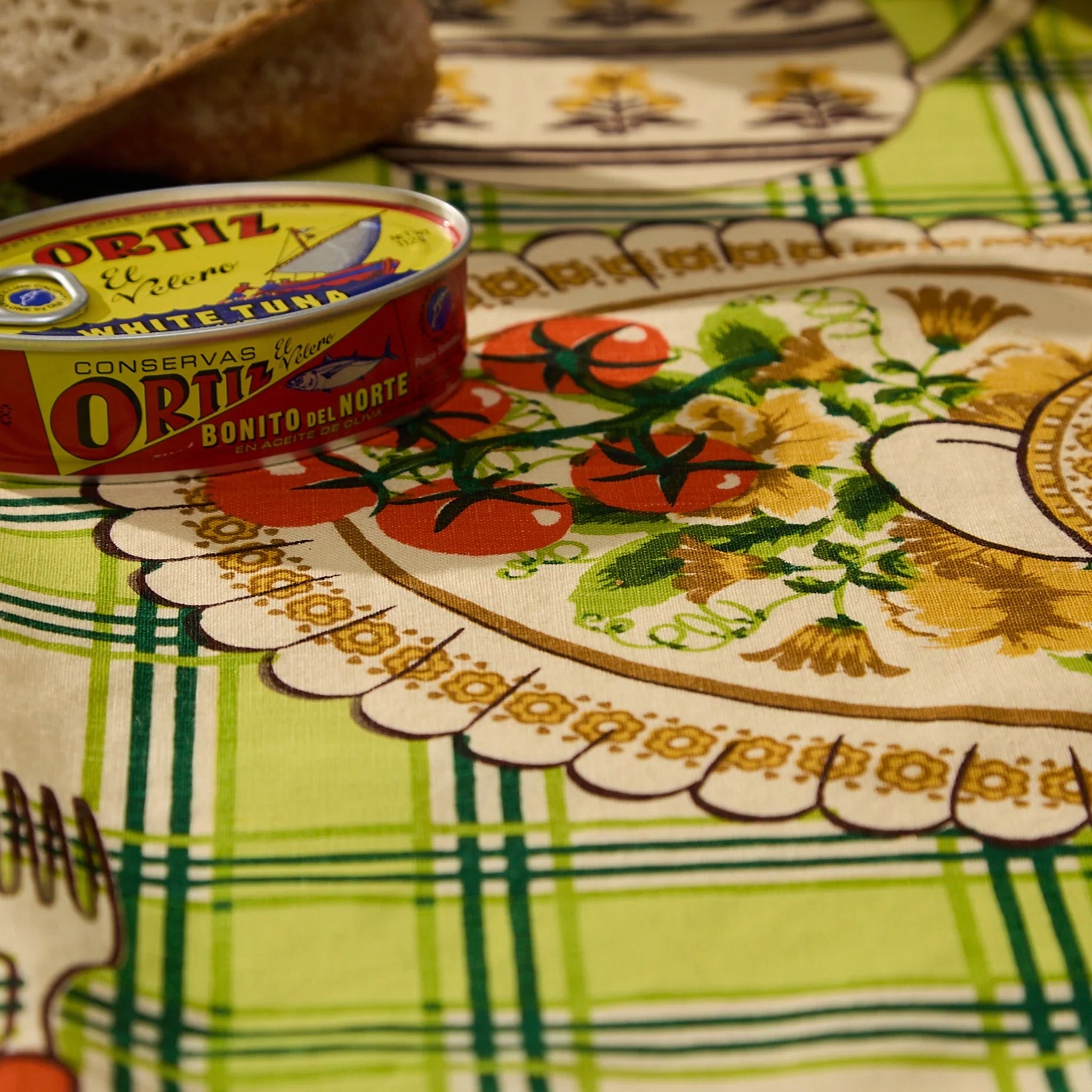 Oritz canned food on a decorative tablecloth with floral patterns