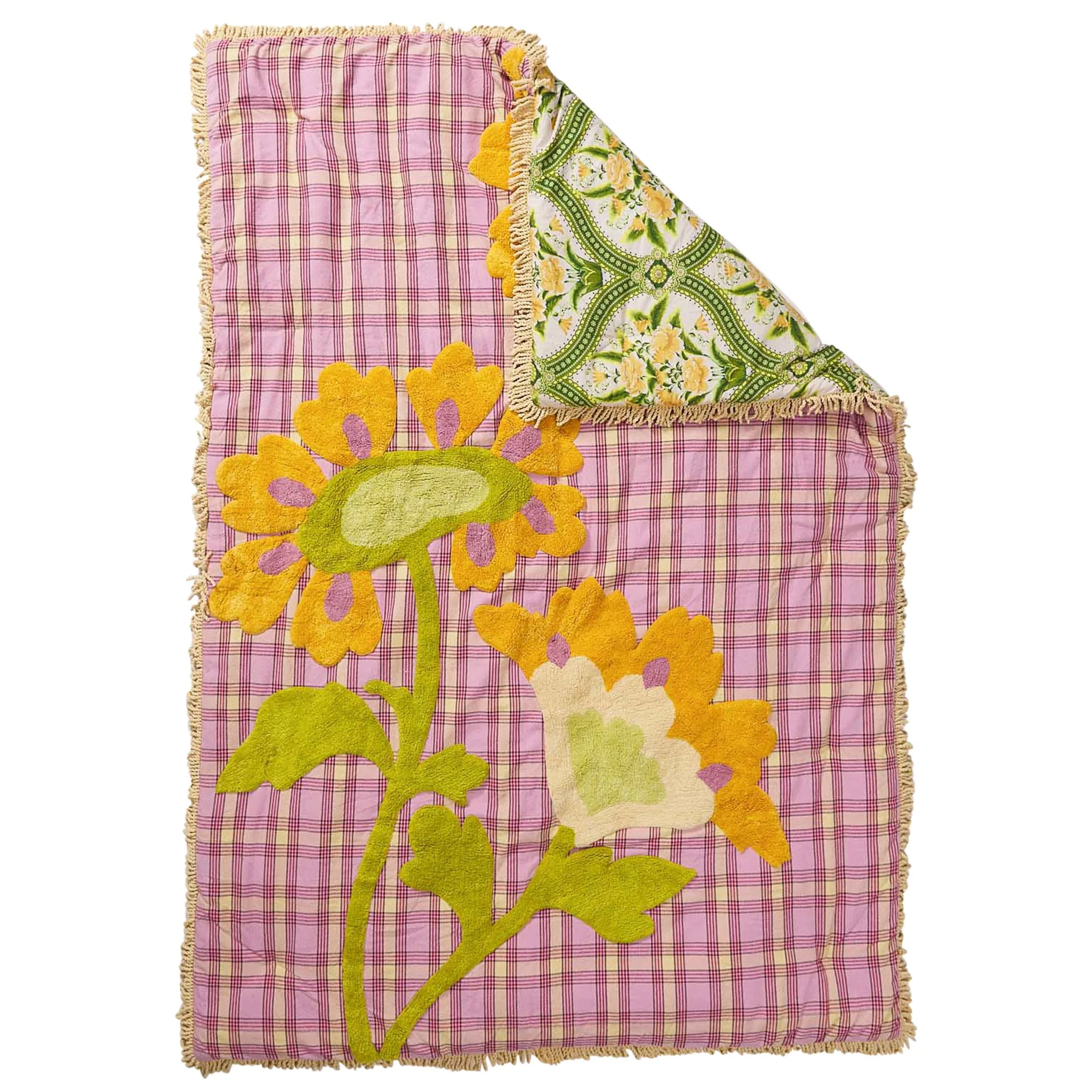 Floral-patterned quilt with checkered border on a white background