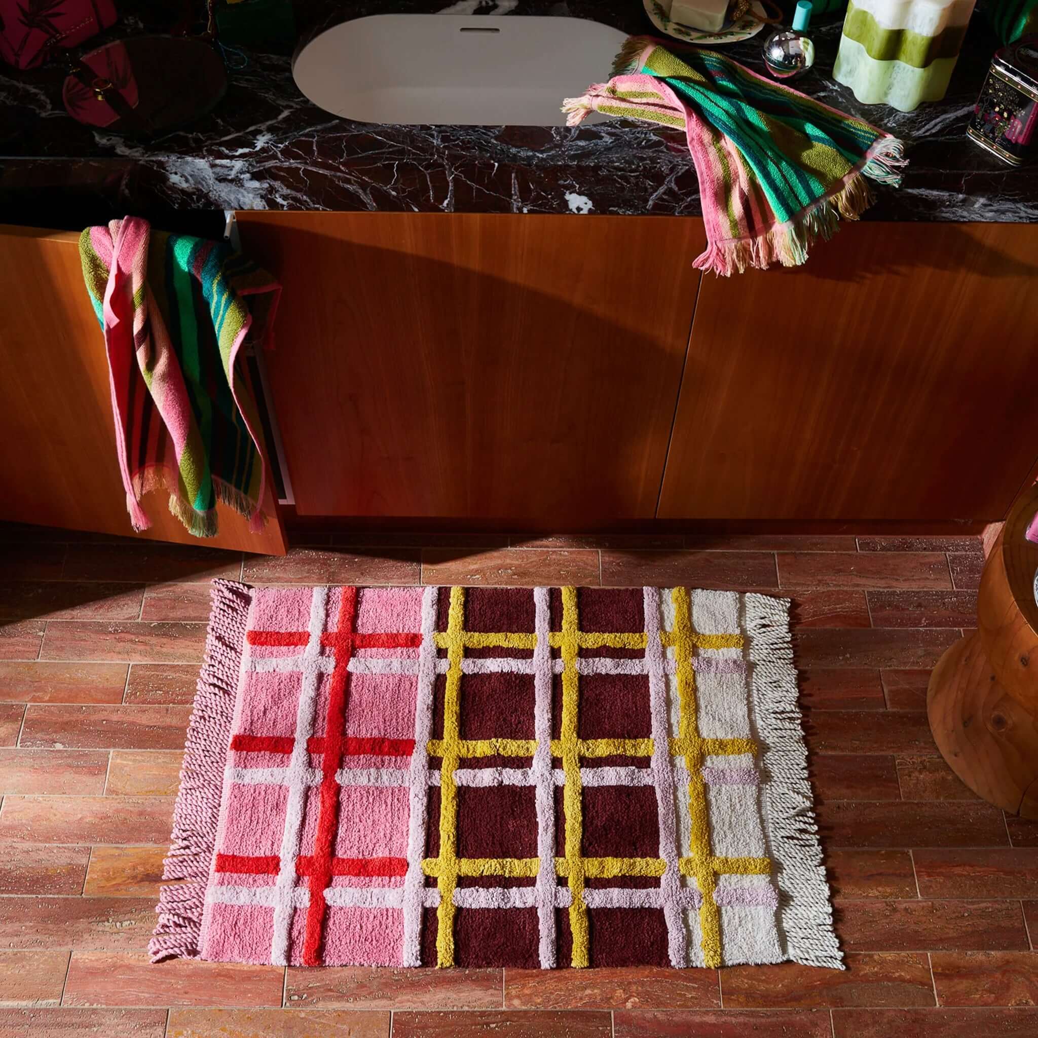 Sage x Clare Karina Bath Mat - Rosewood, a plush, colorful bath mat with fringe trim, made from organic cotton.