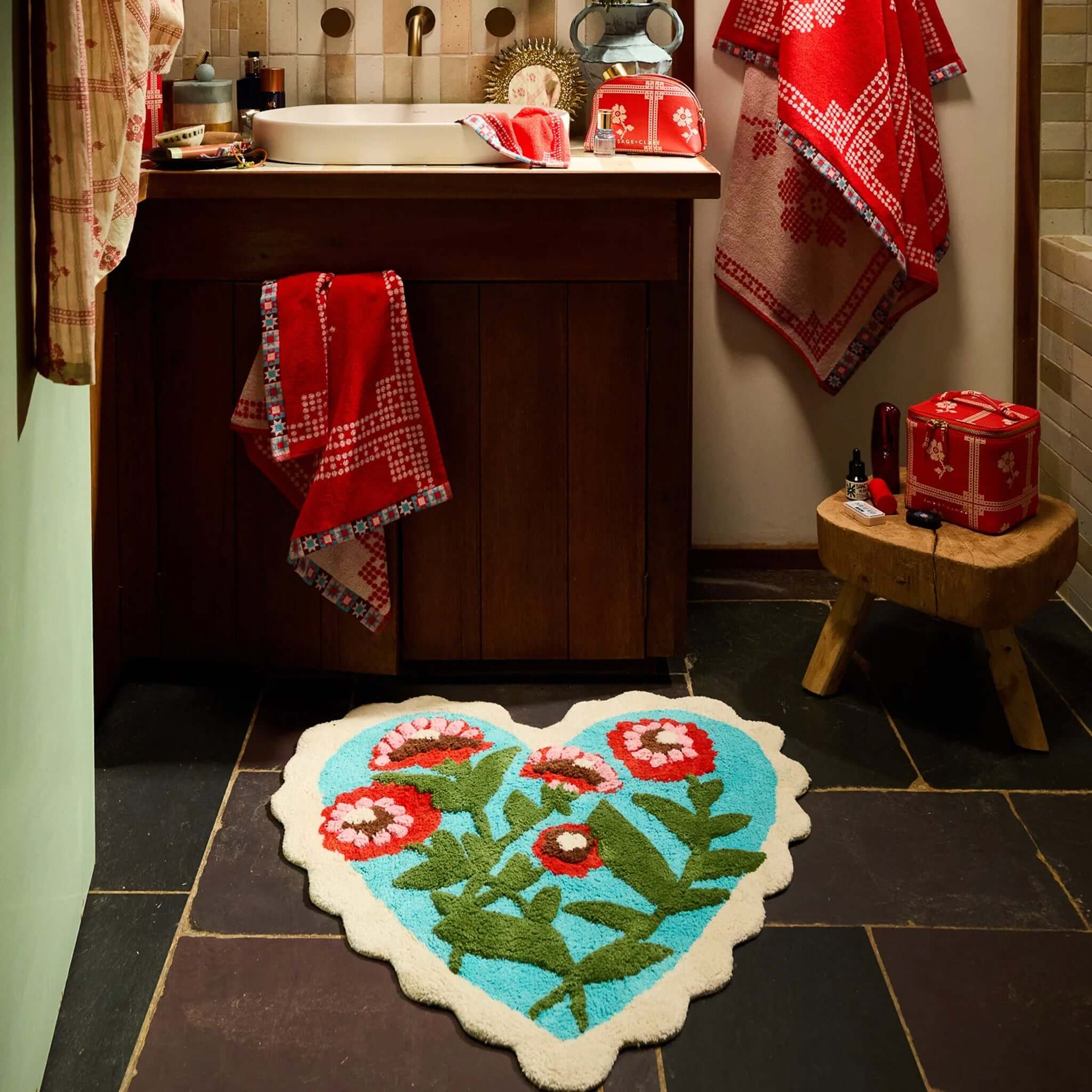 Sage x Clare Loretta Bath Mat in heart shape with flowers, placed in a stylish bathroom setting.