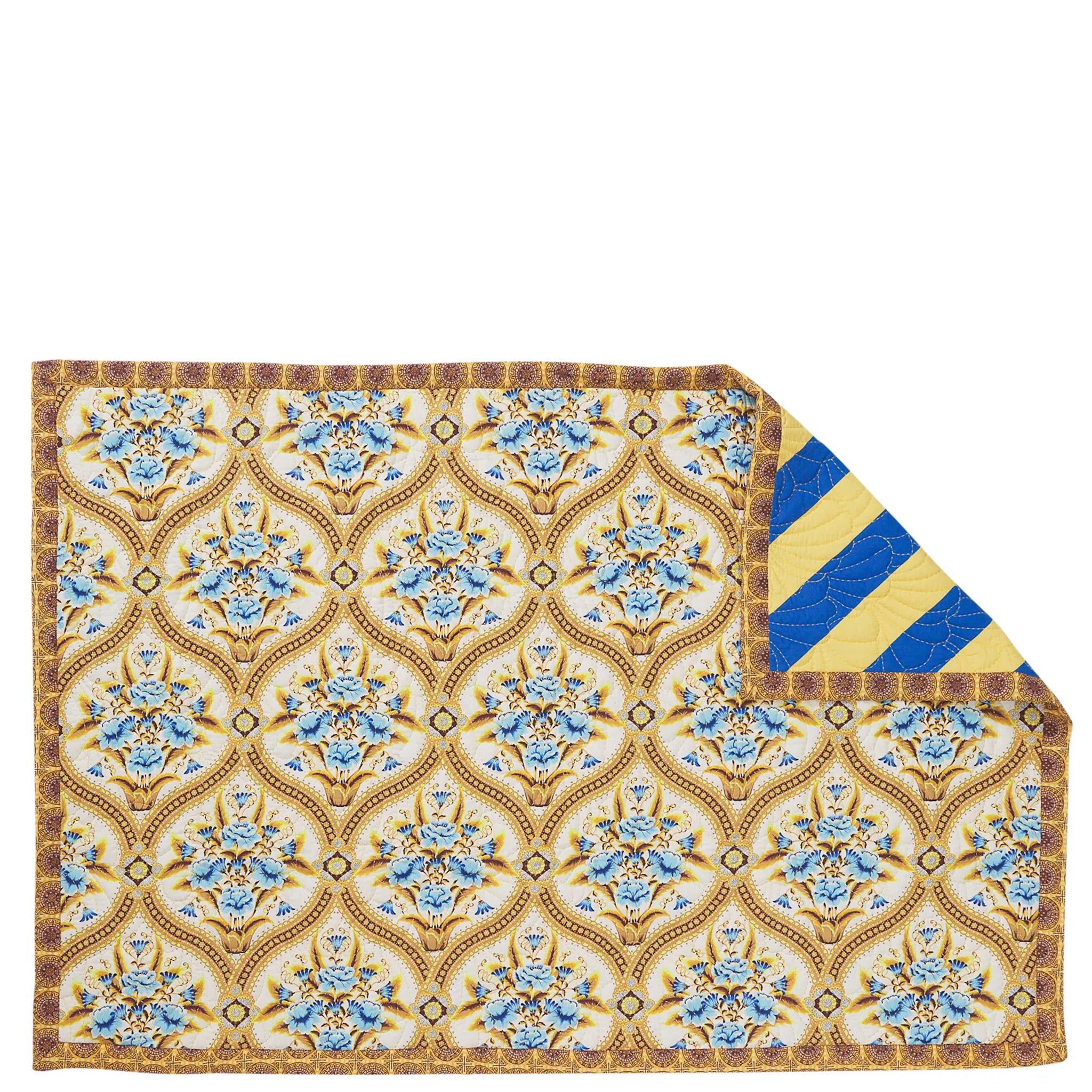 Decorative blanket with floral pattern on a beige background