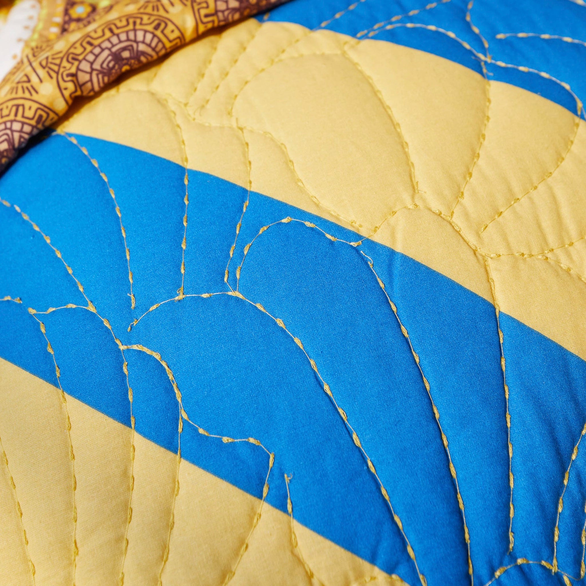 Close-up of a quilt with blue and yellow pattern