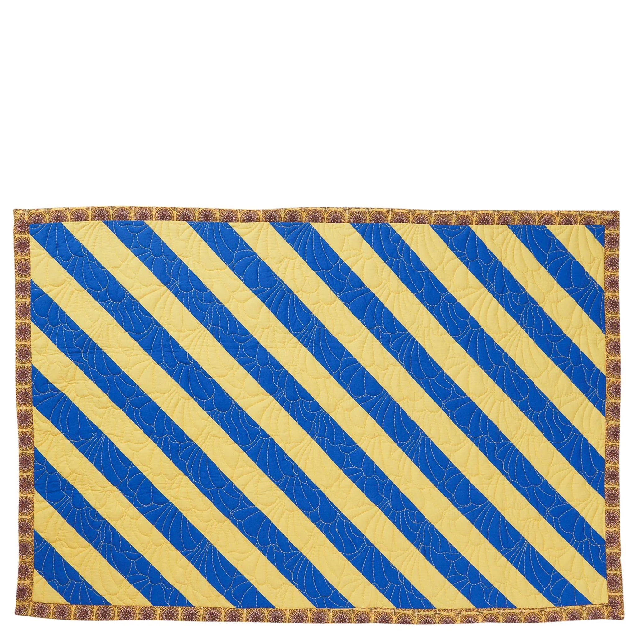 Decorative blanket with striped pattern on a beige background
