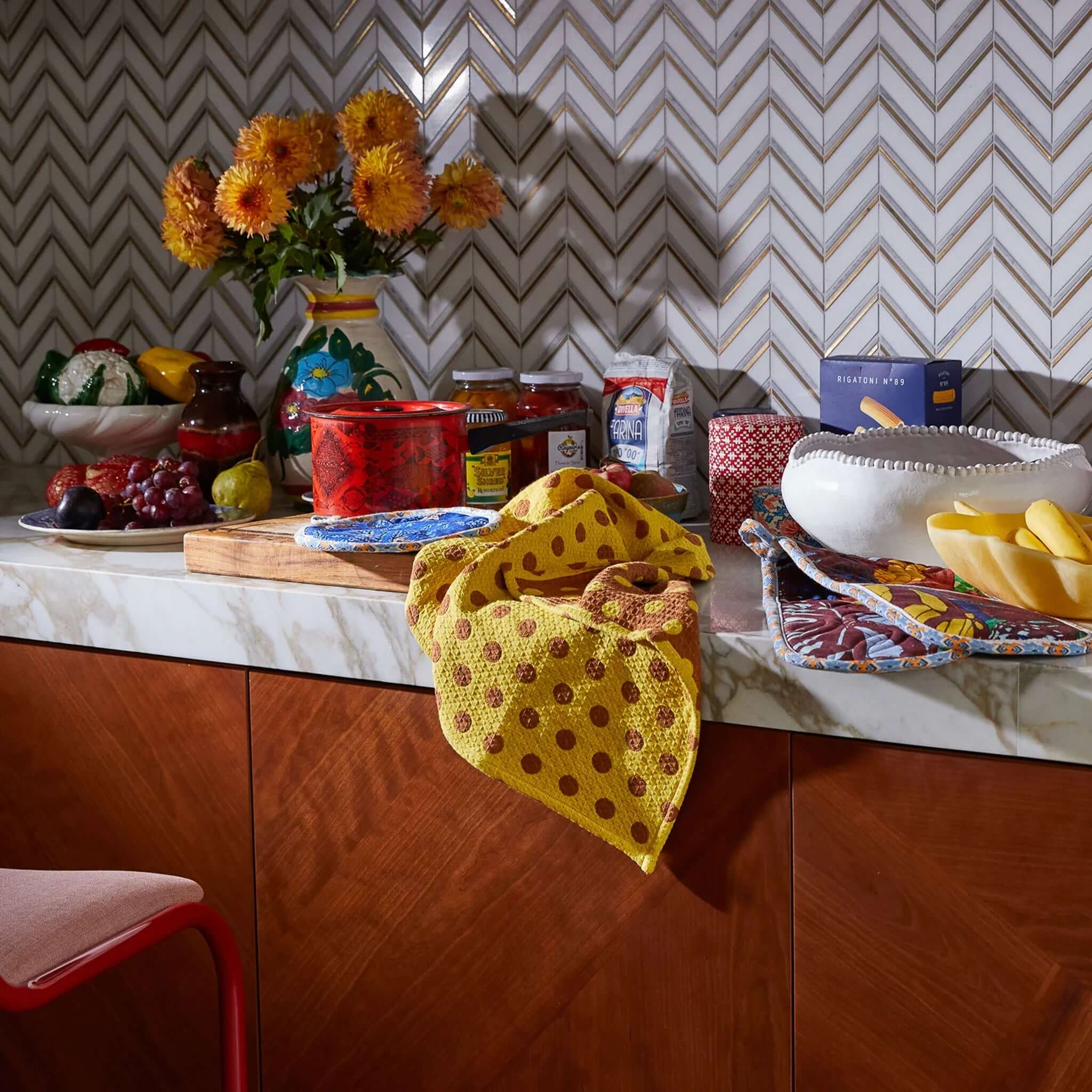 Alt Tag: Sage x Clare Paige Organic Cotton Tea Towel - Medallion bright yellow spot waffle weave tea towel styled on kitchen bench