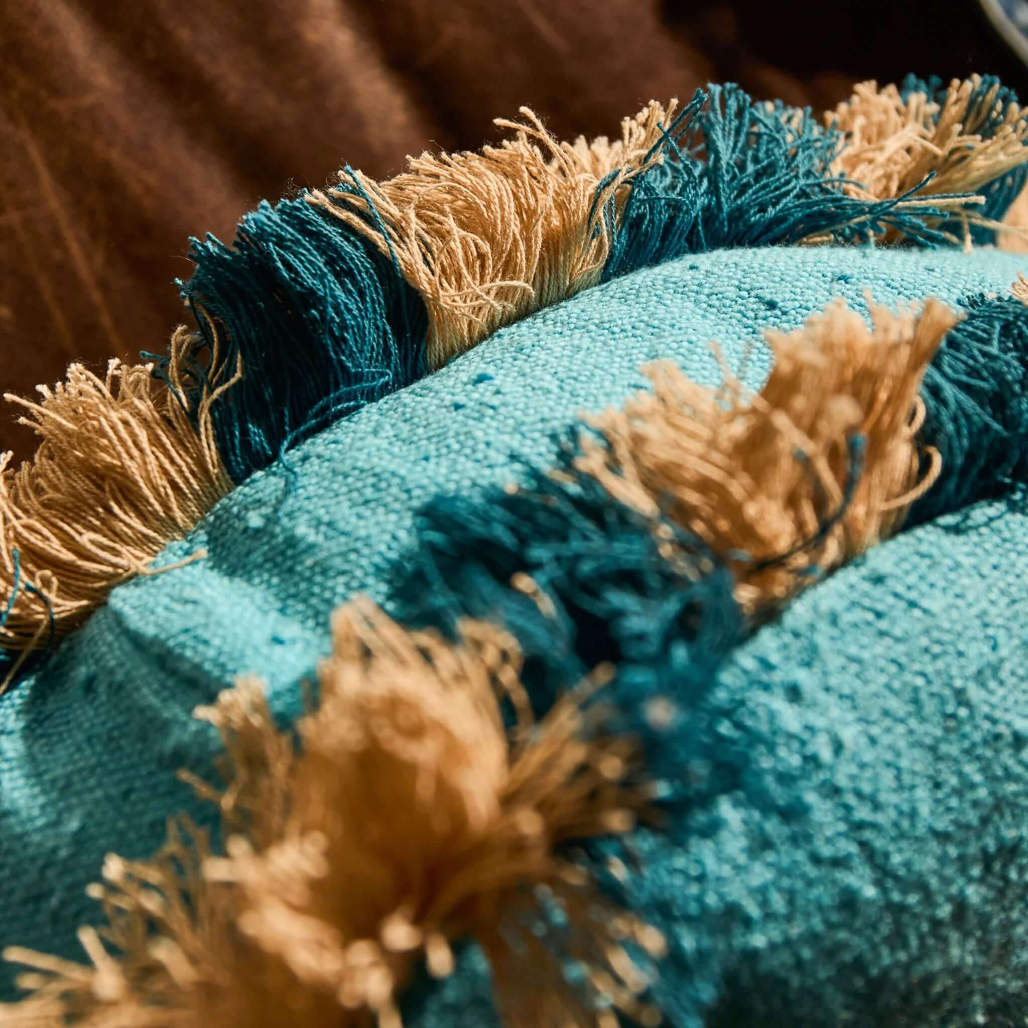 Sage x Clare Reese Round Cushion - Turqouise with turquoise texture and navy and cream fringe detail.
