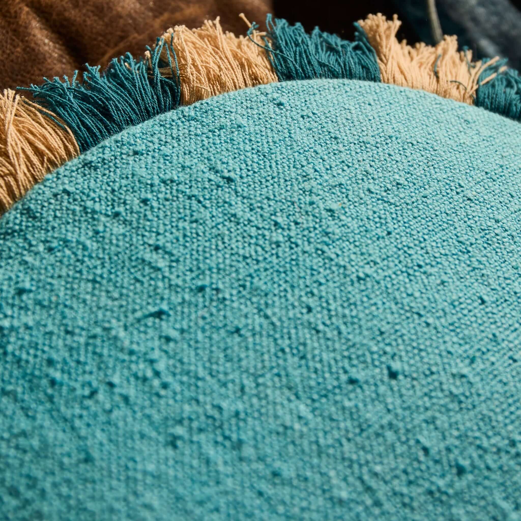 Sage x Clare Reese Round Cushion - Turqouise features textured turquoise cotton and playful navy and cream fringe.