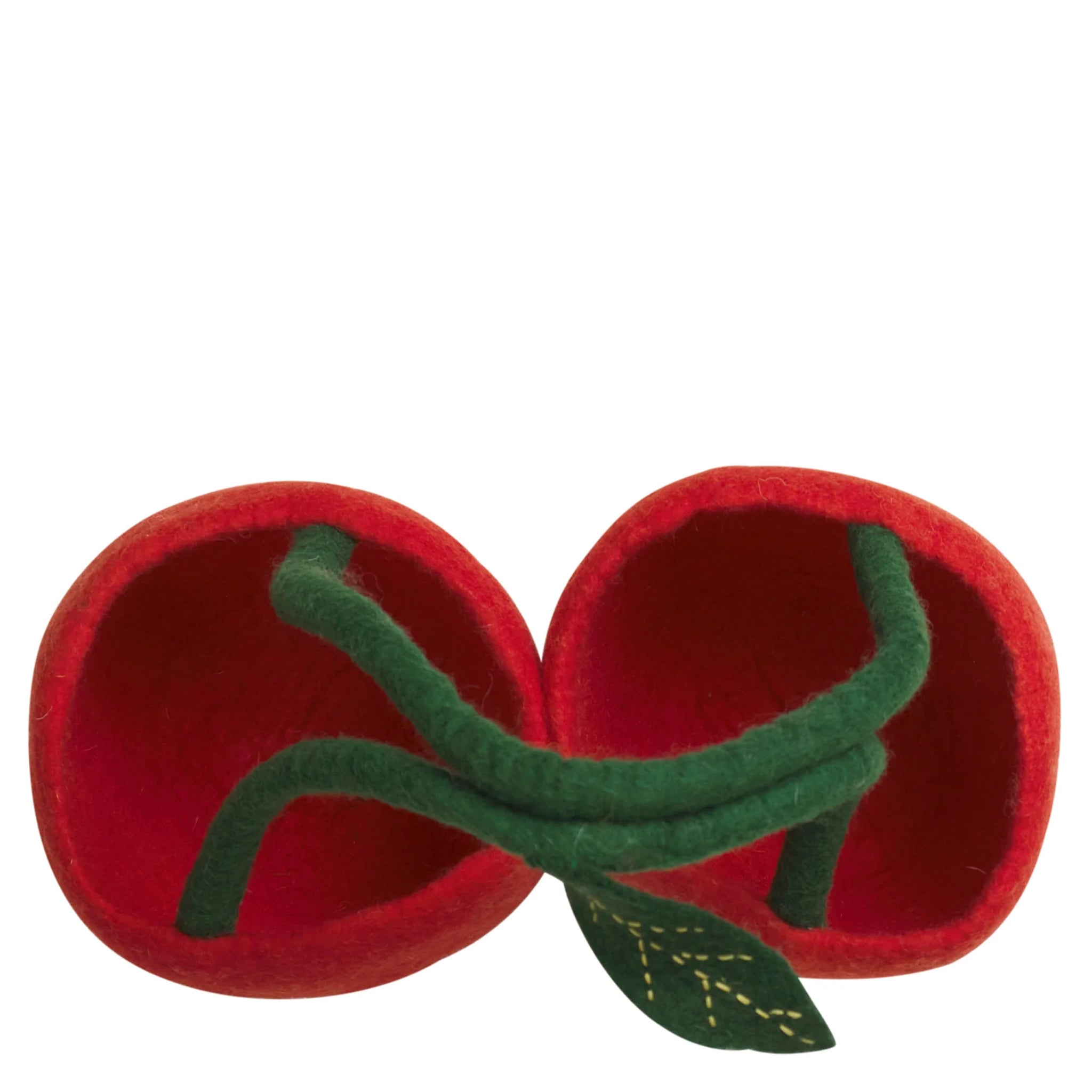 Red felt tomato-shaped toy with green stem on a white background
