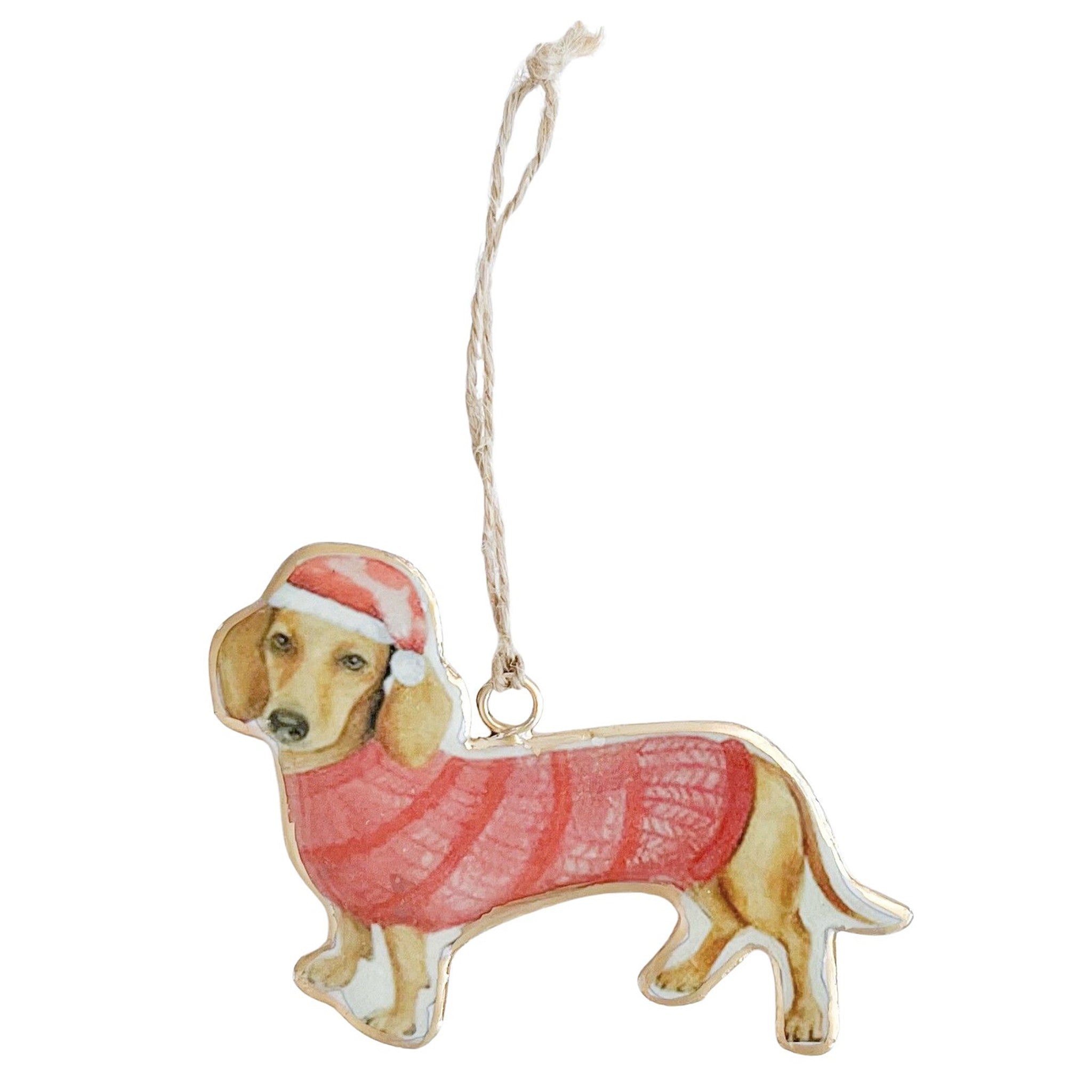 Dog-shaped ornament wearing a red sweater and Santa hat on a white background