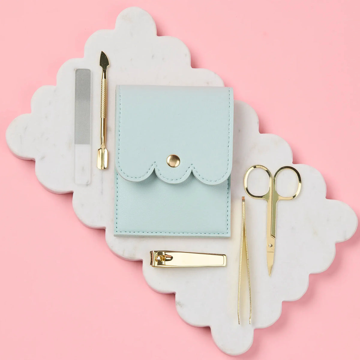 Selfie Nails Manicure Tool Kit - Mint, closed mint pouch beside gold nail tools and glass file