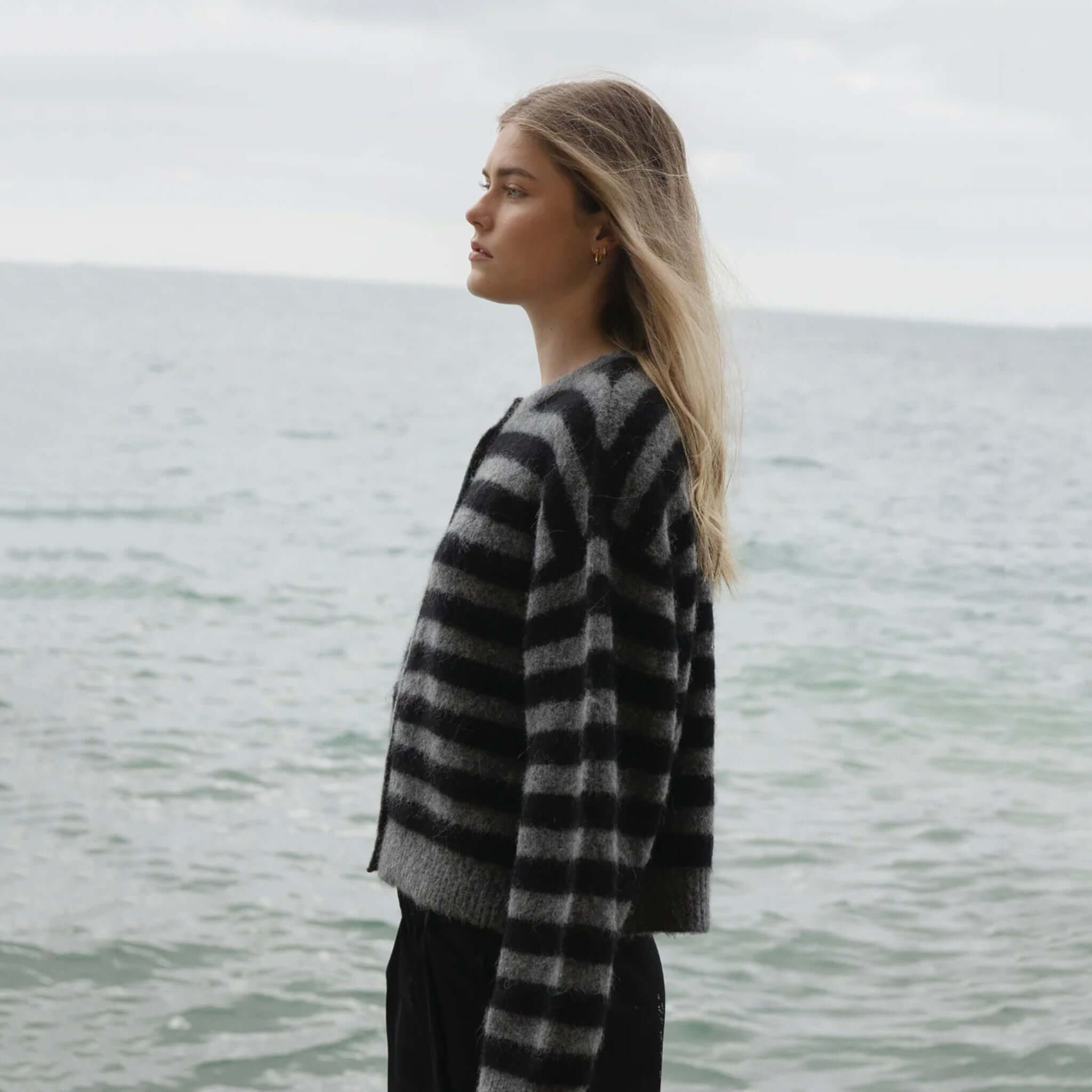 Sophie Alpaca & Merino Blend Cardigan - Graphite Stripe worn by model in side view, soft striped knit layering cardigan