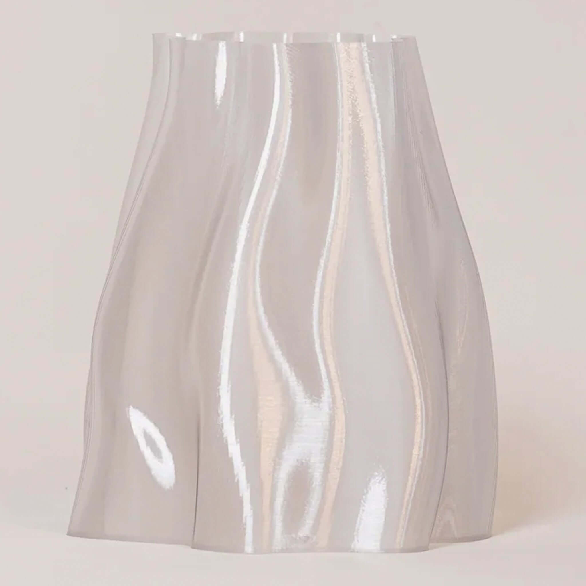 Alt Tag: Special Studio Lulu Bin sculptural curvy storage bin in iridescent clear finish, stylish for planter, waste bin or decor