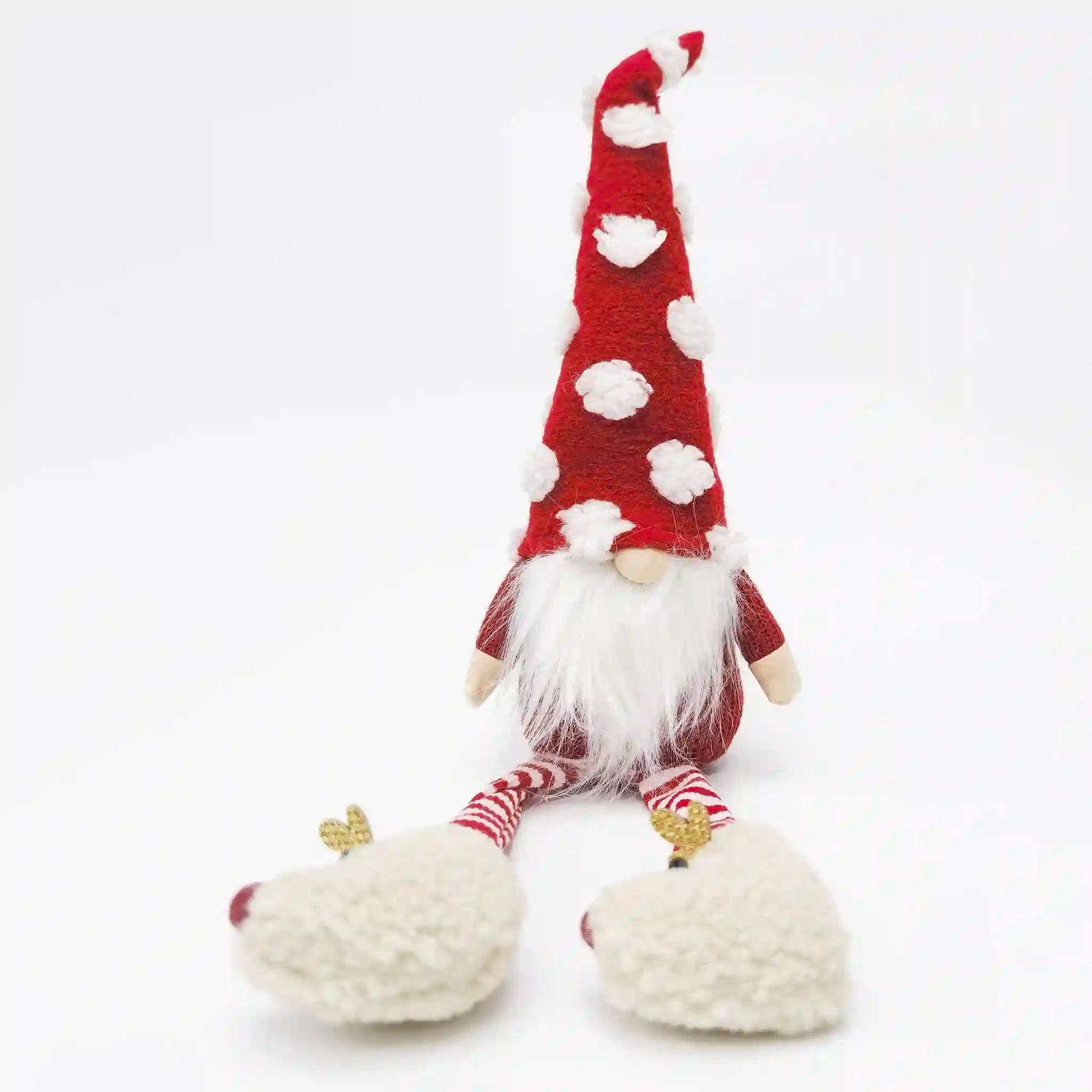 Plush gnome with a red hat and white beard on a white background