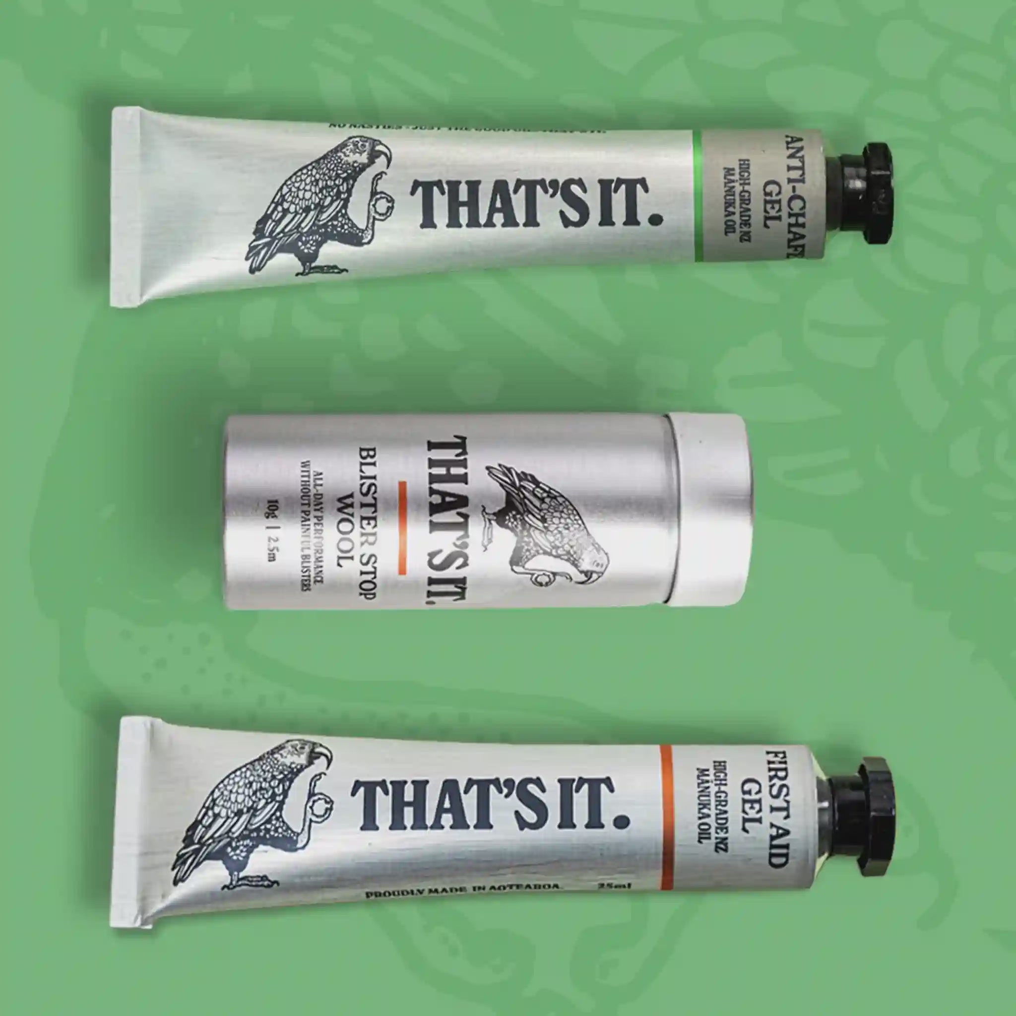Three 'THAT'S IT.' product tubes on a green background