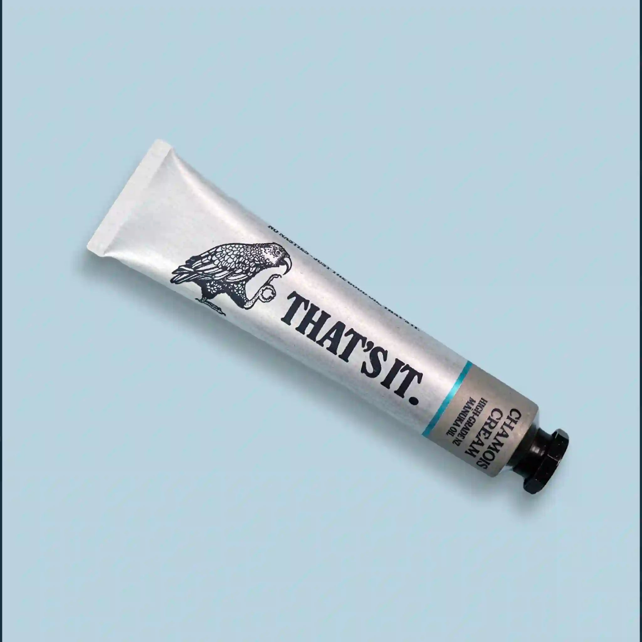 White tube with black text and design on a light blue background